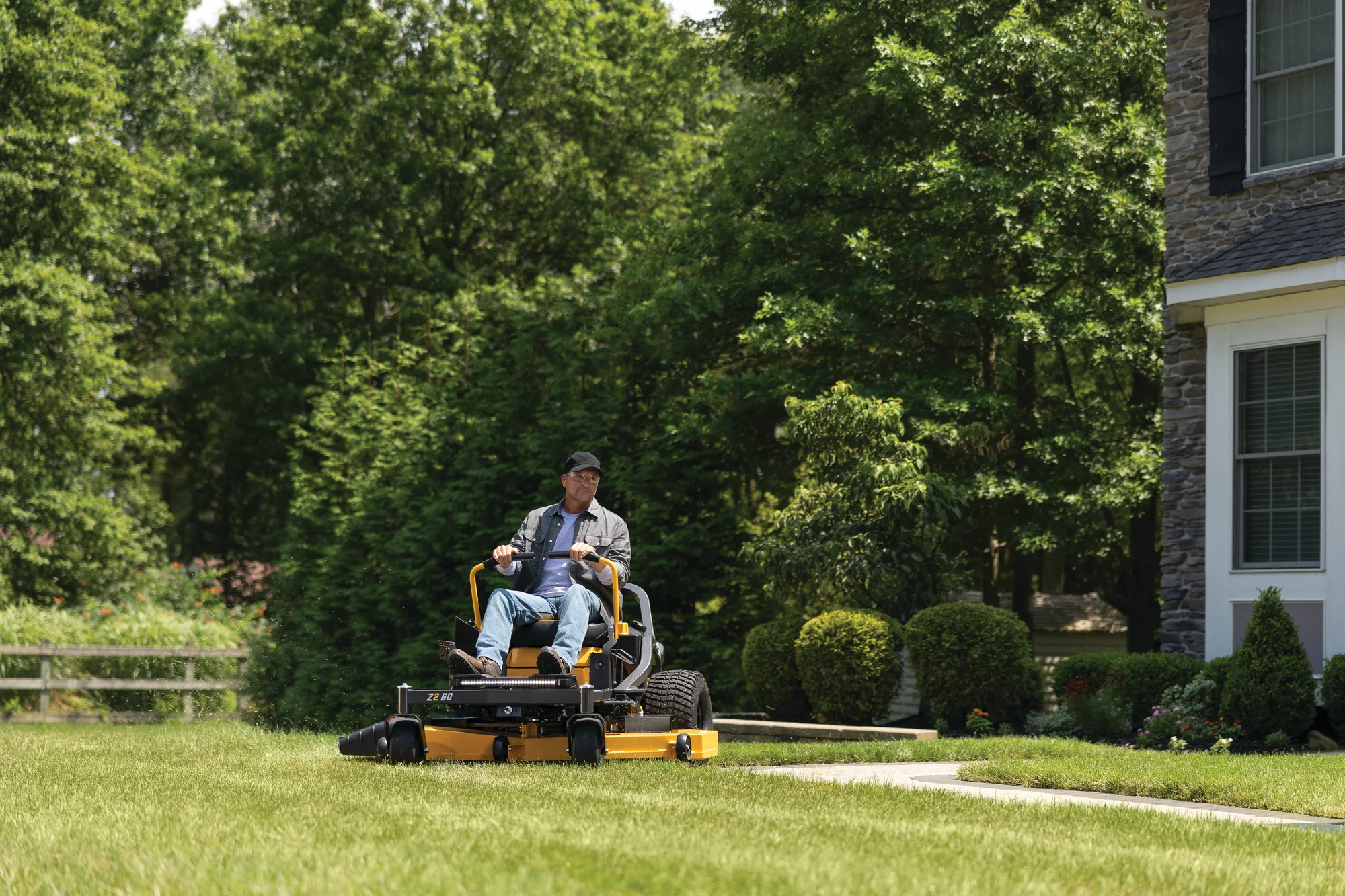 Cub Cadet Ultima Series Z Zero Turn Rider Z2 60 Cub Cadet Ultima Series Z Zero Turn Rider Z2 60 Front View Right Man Cutting Lawn product image