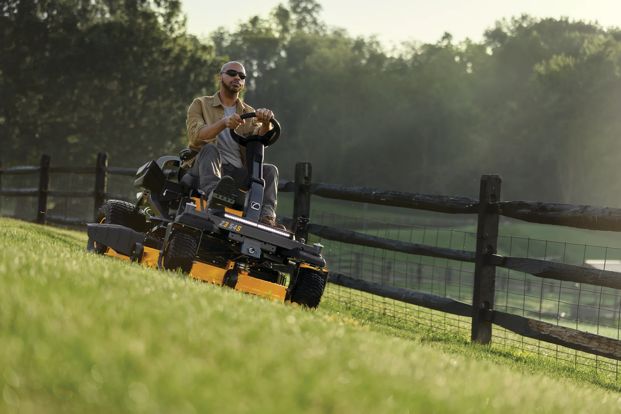 Cub Cadet Ultima Series Zs Zero Turn Rider Z3 54S Front View Left Man Cutting Lawn product image
