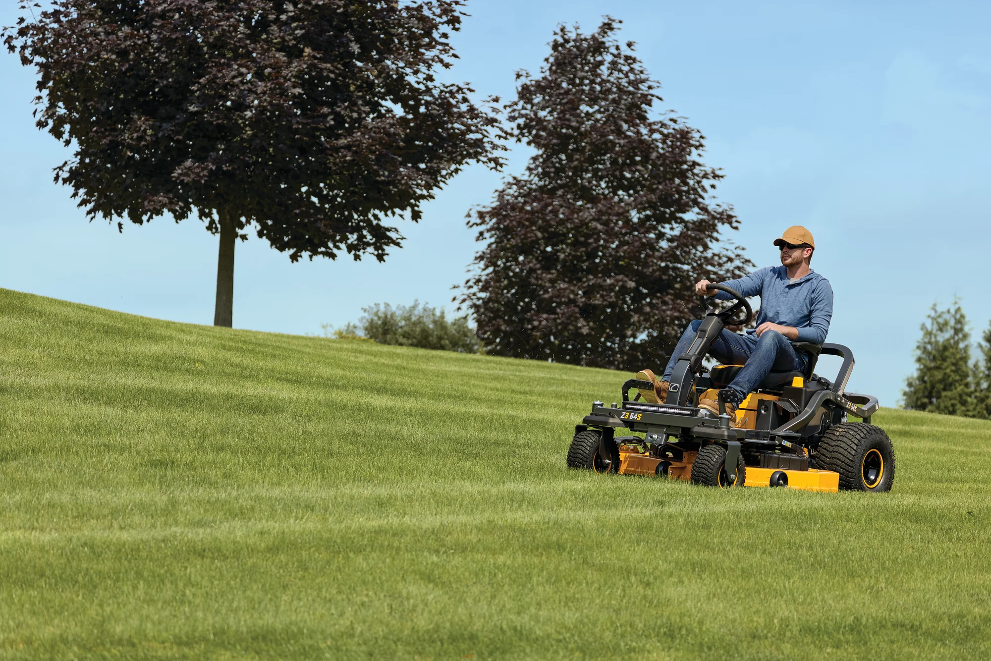 Cub Cadet Ultima Series Zs Zero Turn Rider Z3 54S Front View Right Man Cutting Lawn product image