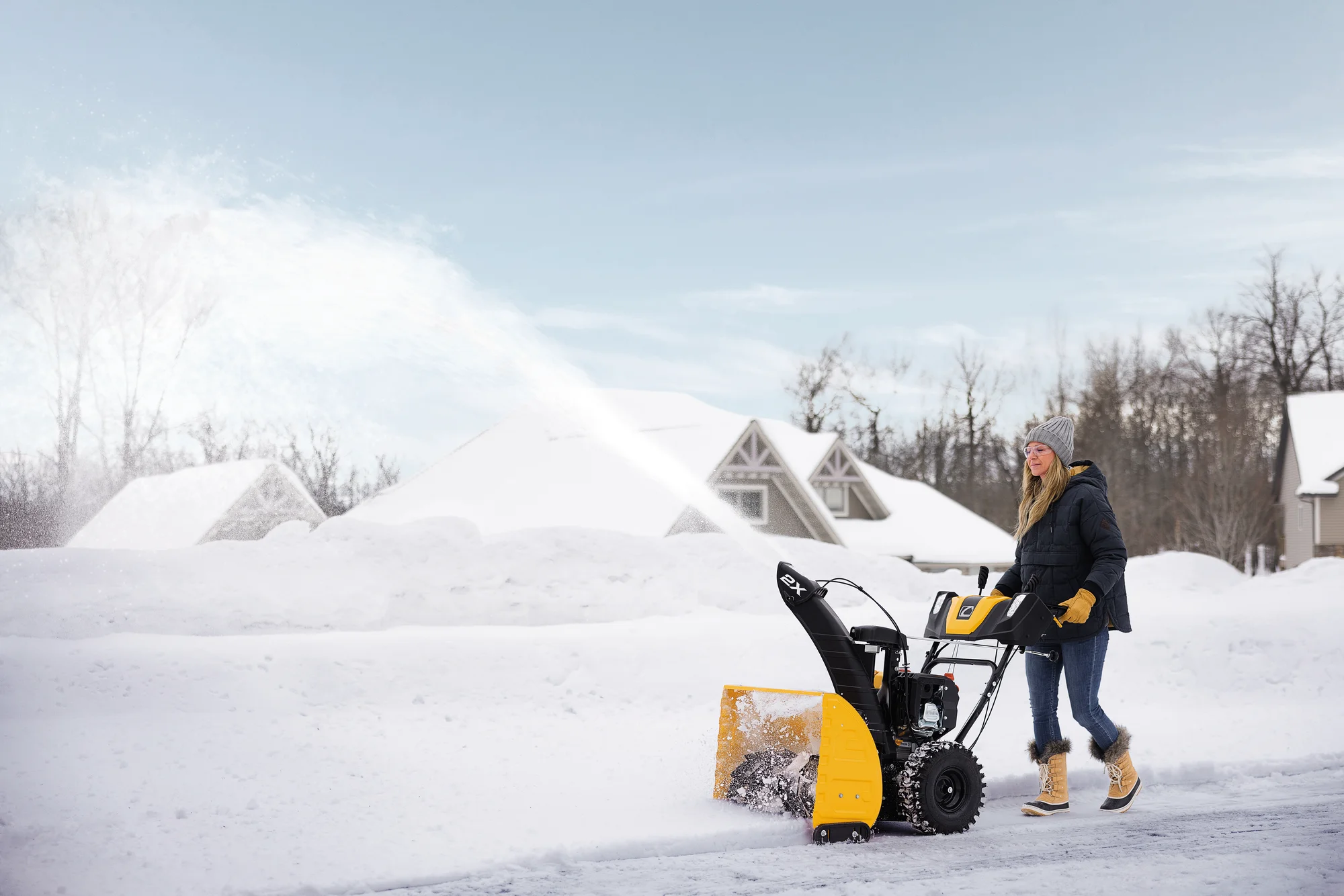 Cubcadet 2X Series Two Stage Snow Blower 2X24 Egov Woman Clearing Driveway product image