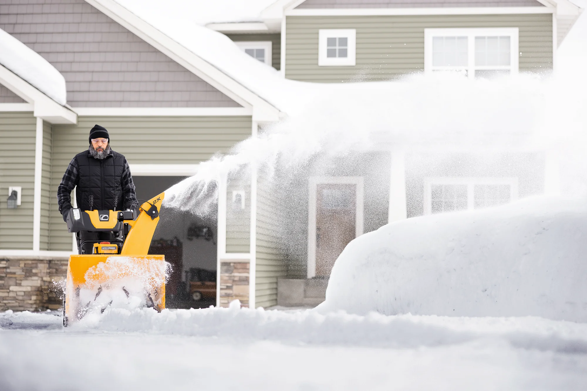 Cubcadet 2X Series Two Stage Snow Blower 2X28 Egov Man Clearing Sidewalk House product image
