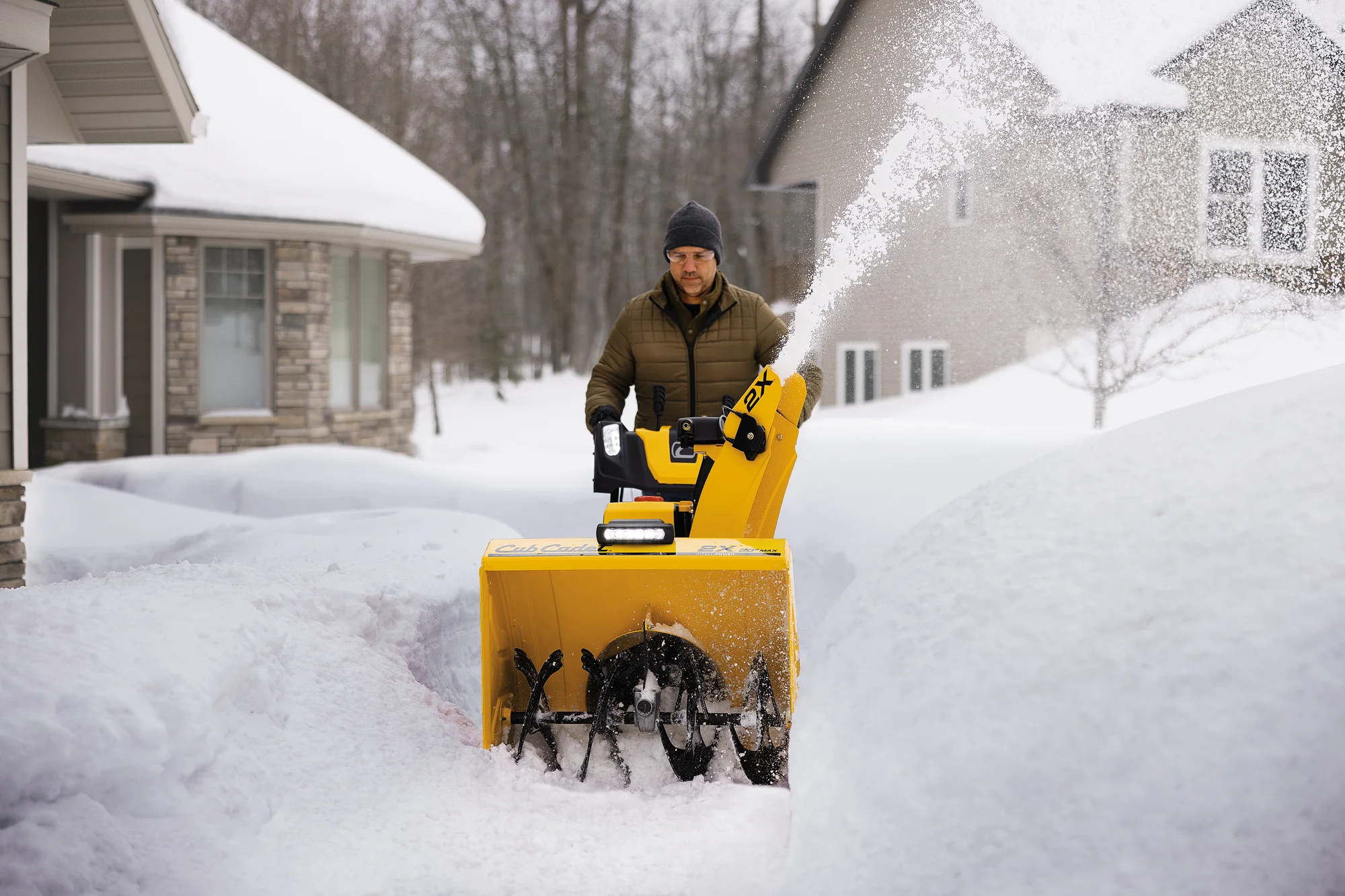 Cubcadet 2X Series Two Stage Snow Blower 2X30 Max Egov Man Clearing Driveway Front View product image