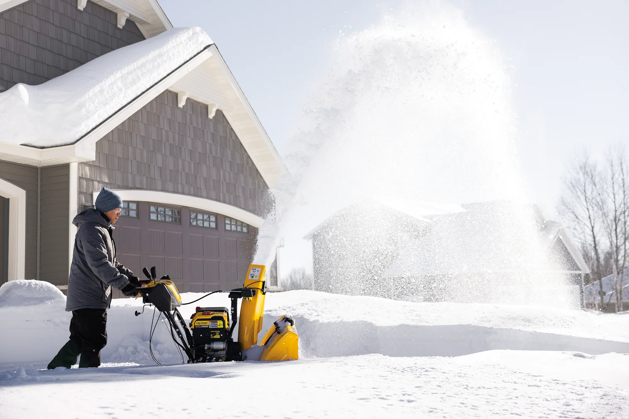 Cubcadet 3X Series Three Stage Snow Blower 3X30 Hd Egov Man Clearing Driveway Side View product image