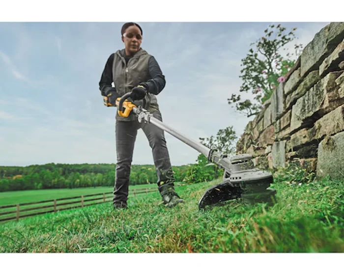 Dewalt 20V Max Folding String Trimmer Dcst922B Woman Trimming Grass product image