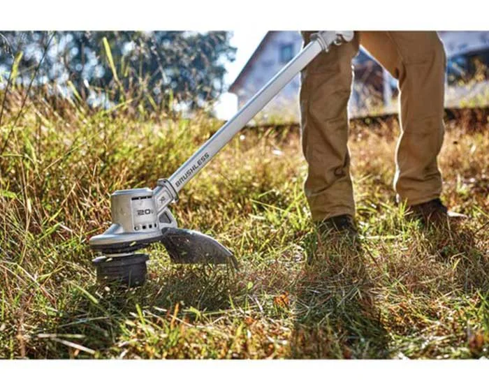 Dewalt 20V Max Folding String Trimmer Dcst922P1 Man Trimming Grass product image