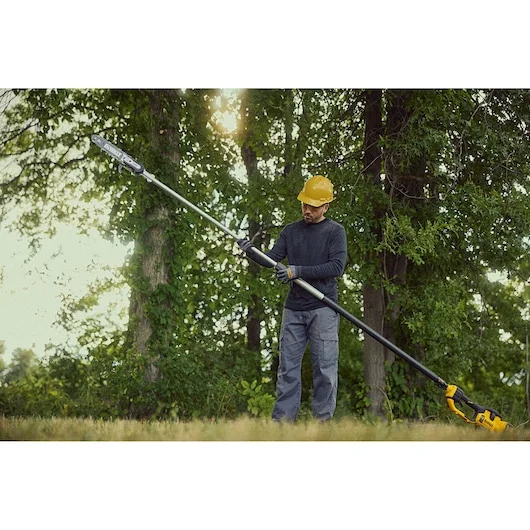 Dewalt 60V Pole Saw Dcps671X1 Man Adjusting Height product image