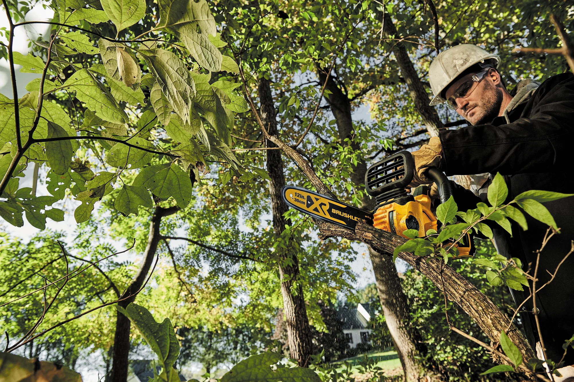 Dewalt Chainsaw Dccs620B Man Cutting Brush product image
