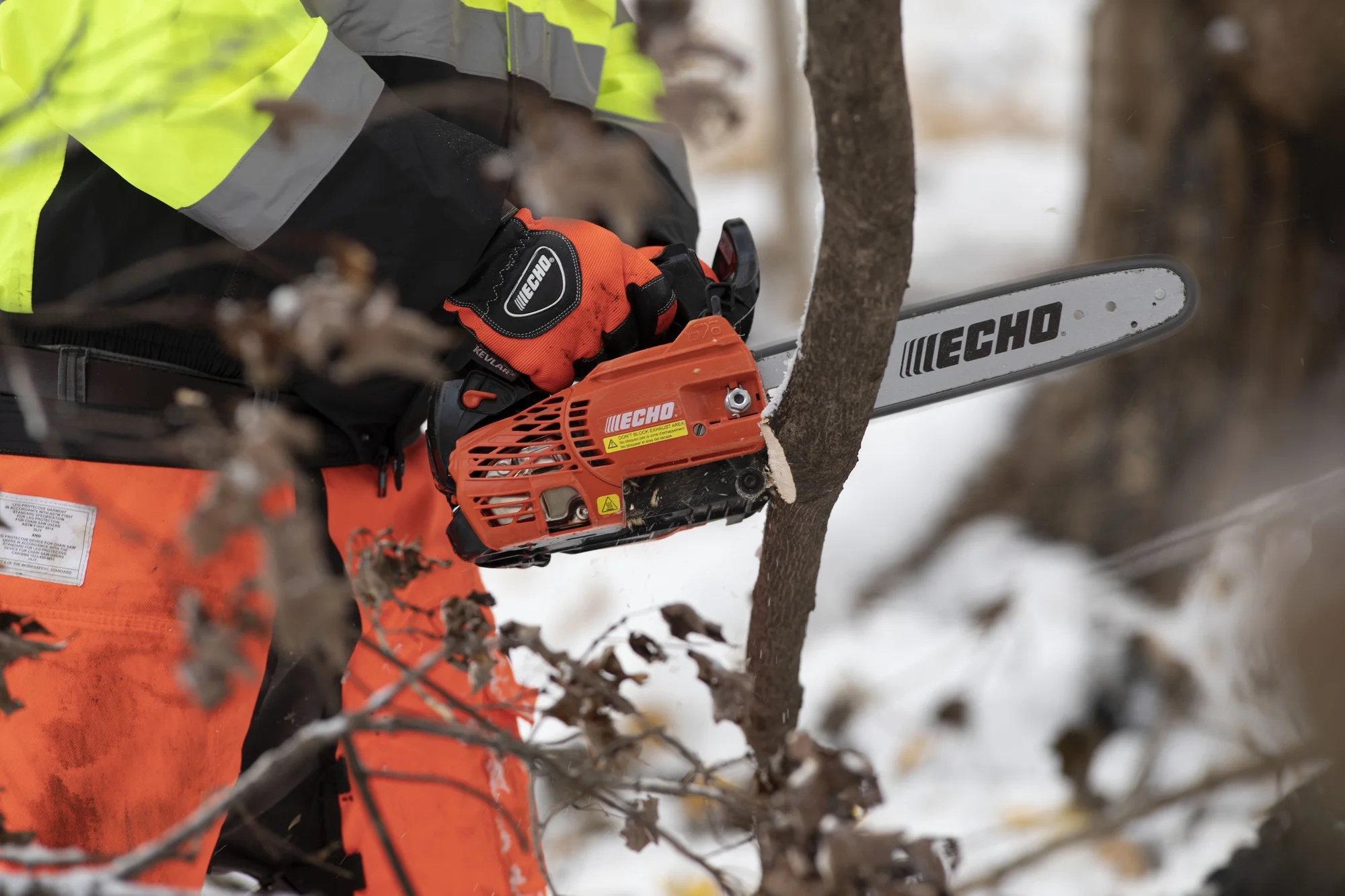 Echo Cs Series Chainsaw Cs2511T 12 Man Cutting Branch Side View product image