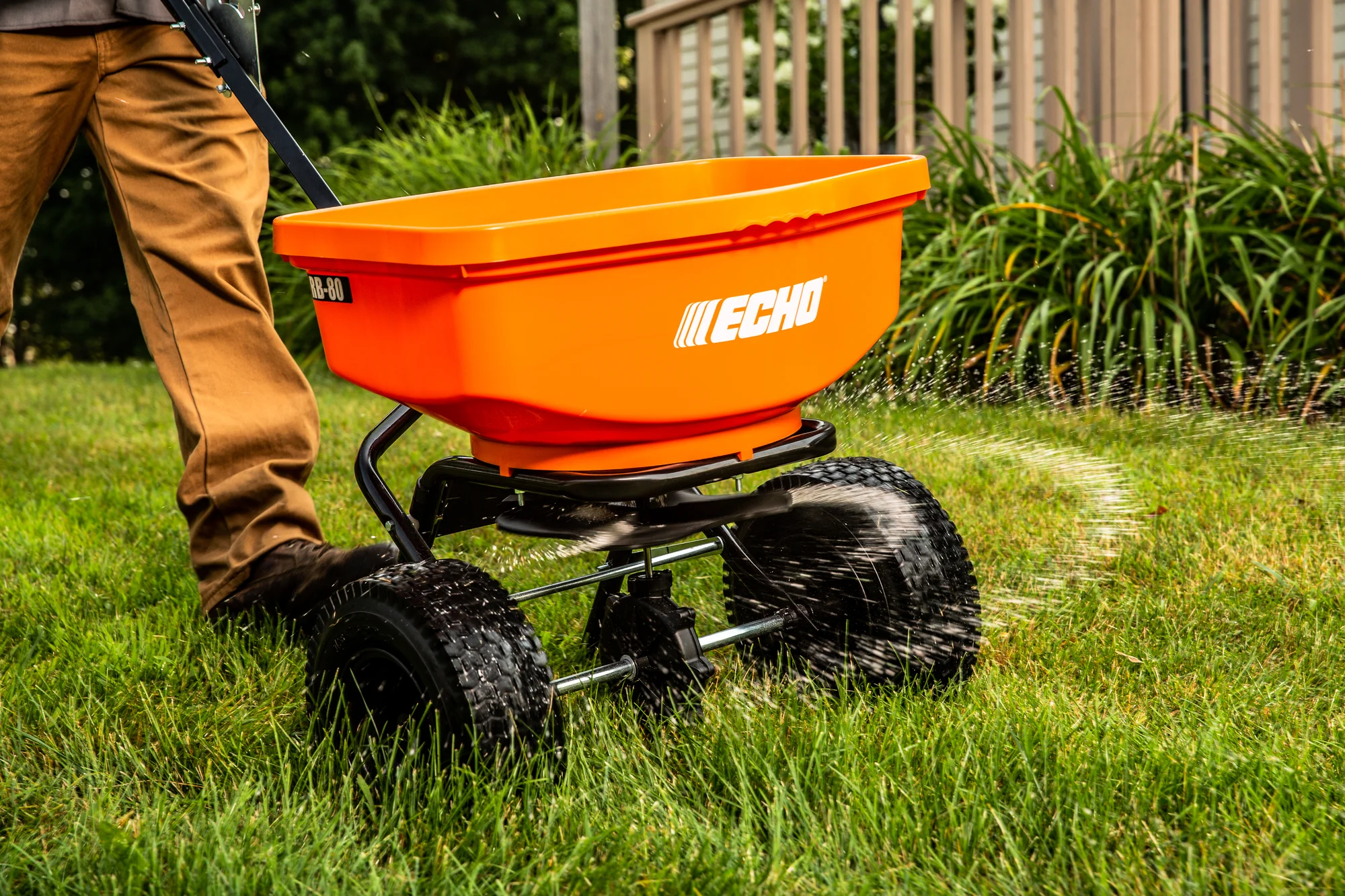 Echo Rb Series Spreader Rb 85W Man Spreading Grass Seed Closeup product image