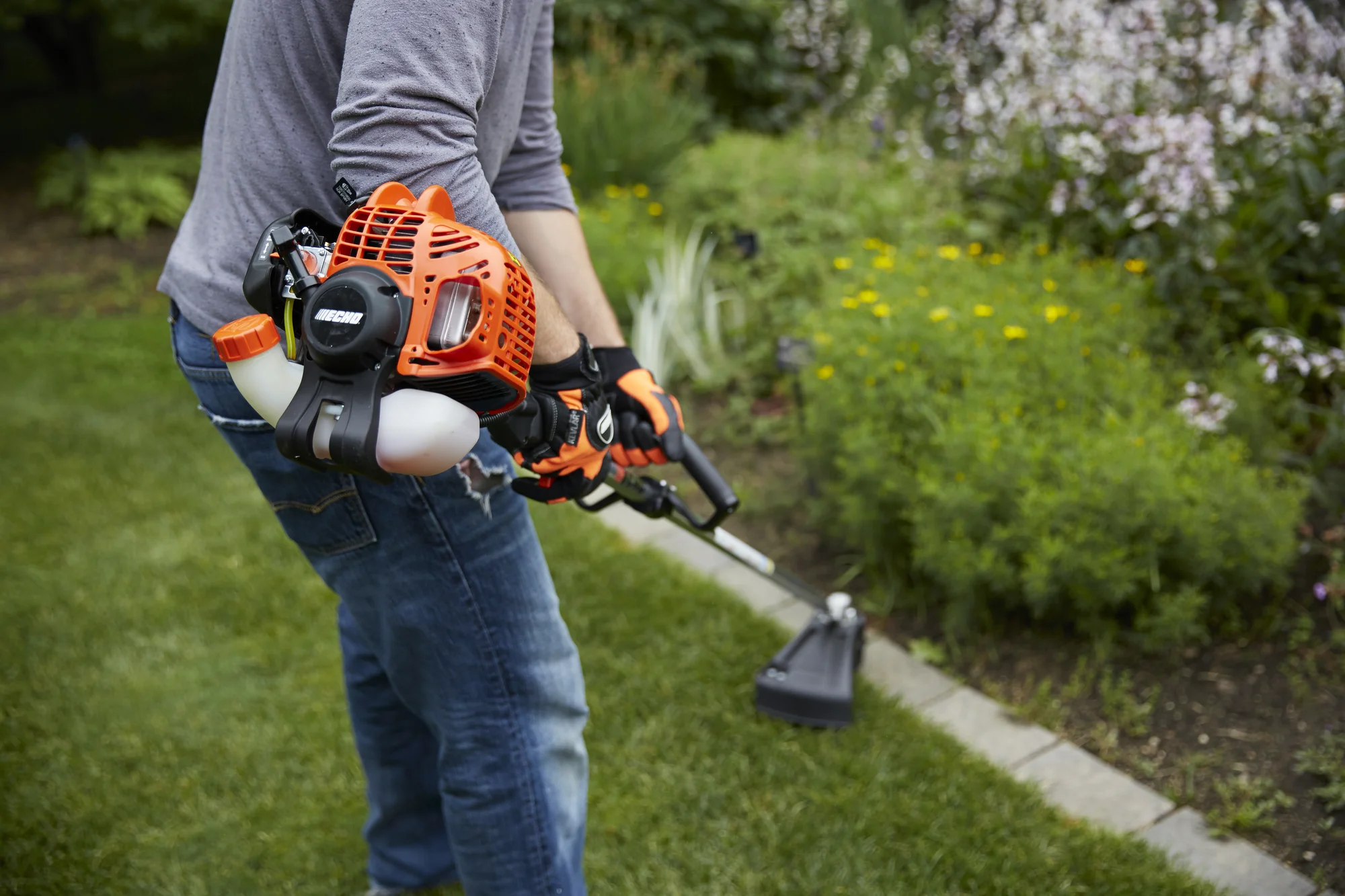 Echo Srm Series Trimmer Srm 225I Woman Trimming Flower Bed product image