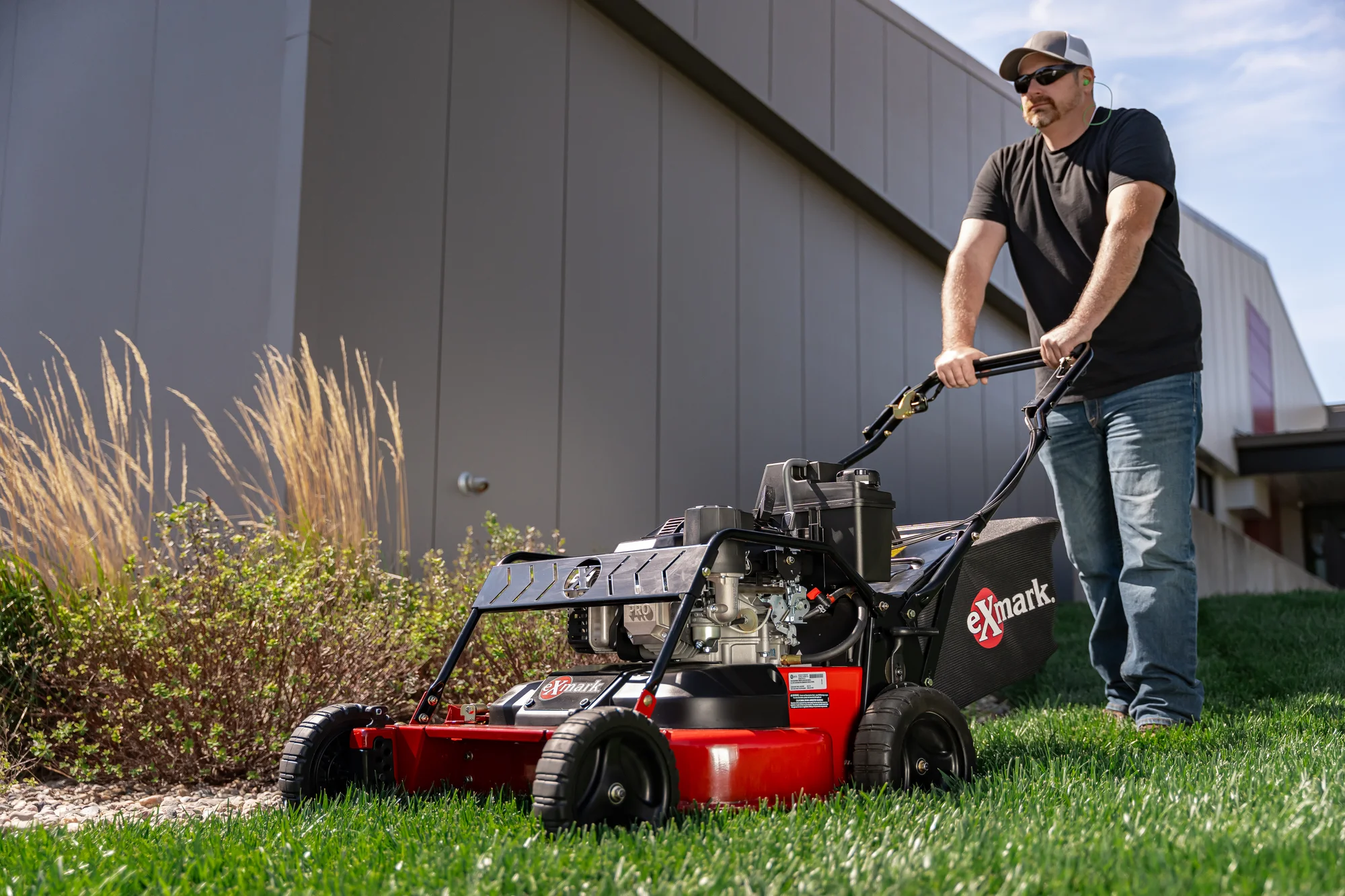 Exmark Commercial 30 X Series Walk Behind Lawn Mower Ecx200Gkc30000 Man Pushing Mower product image