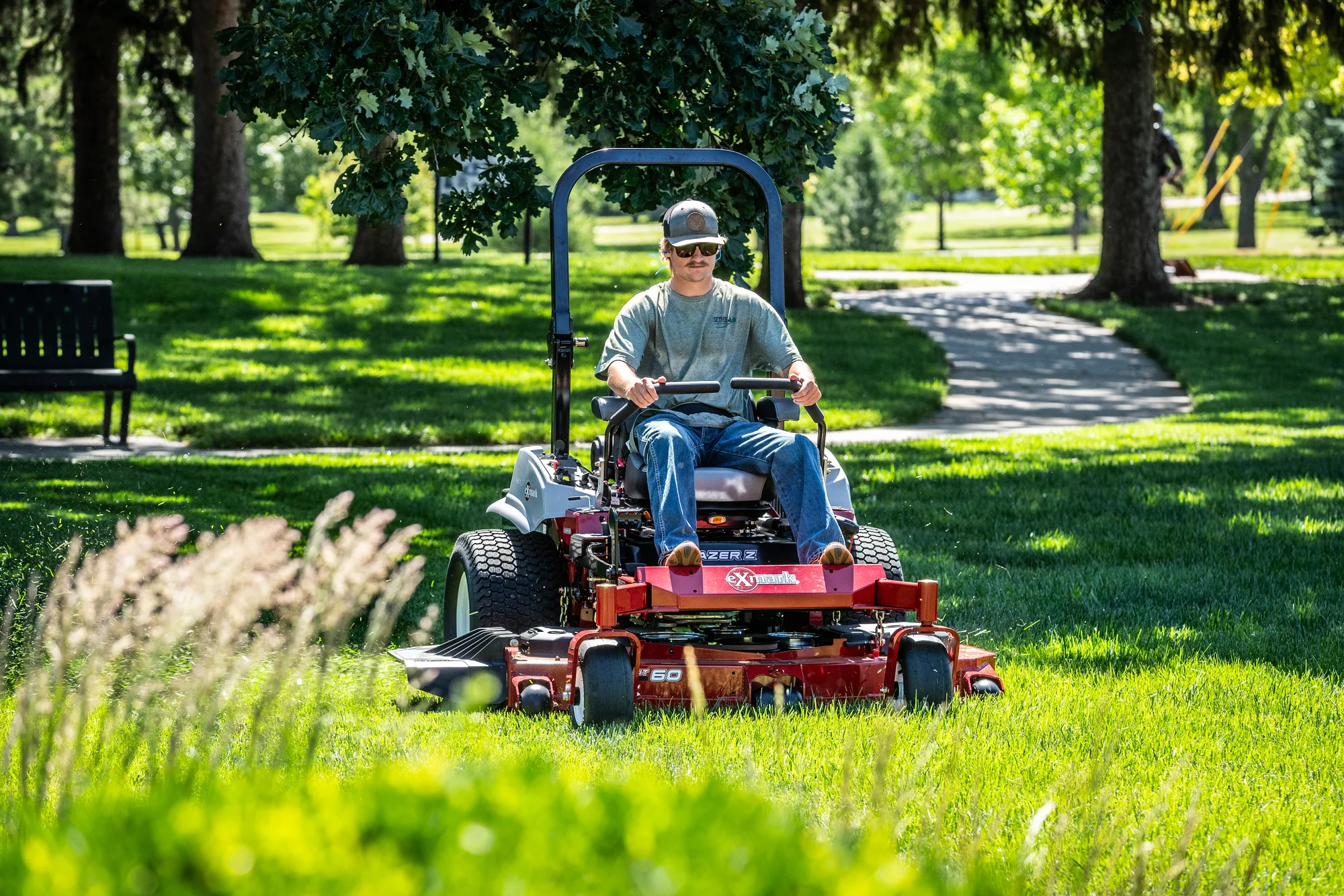 Exmark Lazer Z E Series Zero Turn Rider LRE730GKA524A3 Exmark Lazer Z E Series Zero Turn Rider Lre730Gka524A3 Landscaper Mowing Park Tall Grass product image