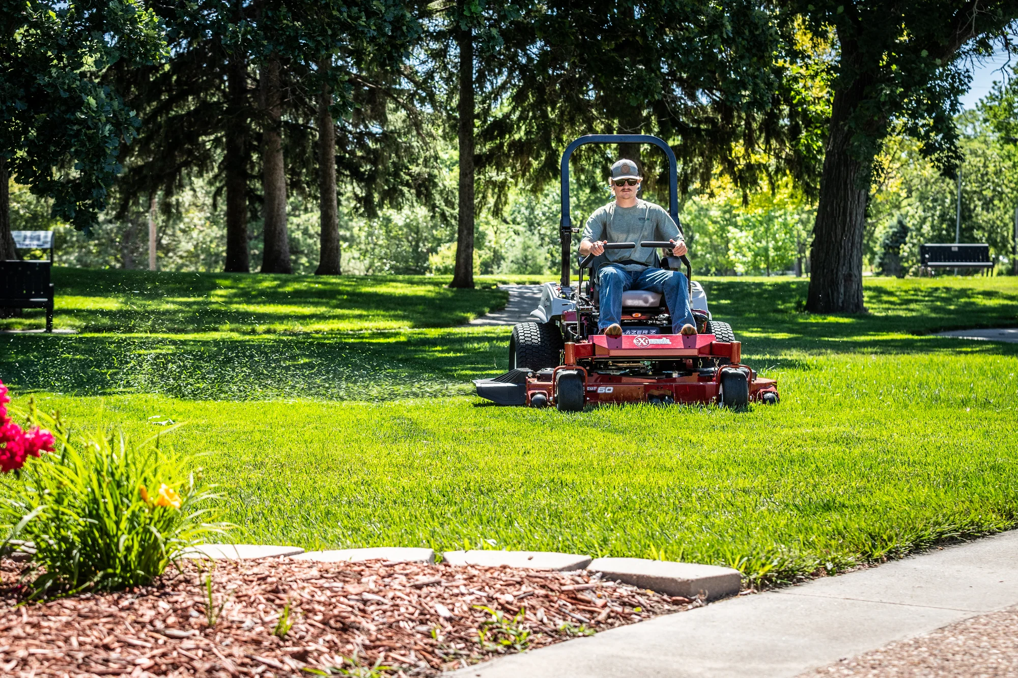 Exmark Lazer Z E Series Zero Turn Rider Lre810Gbv604A3 Landscaper Mowing Park Distant product image