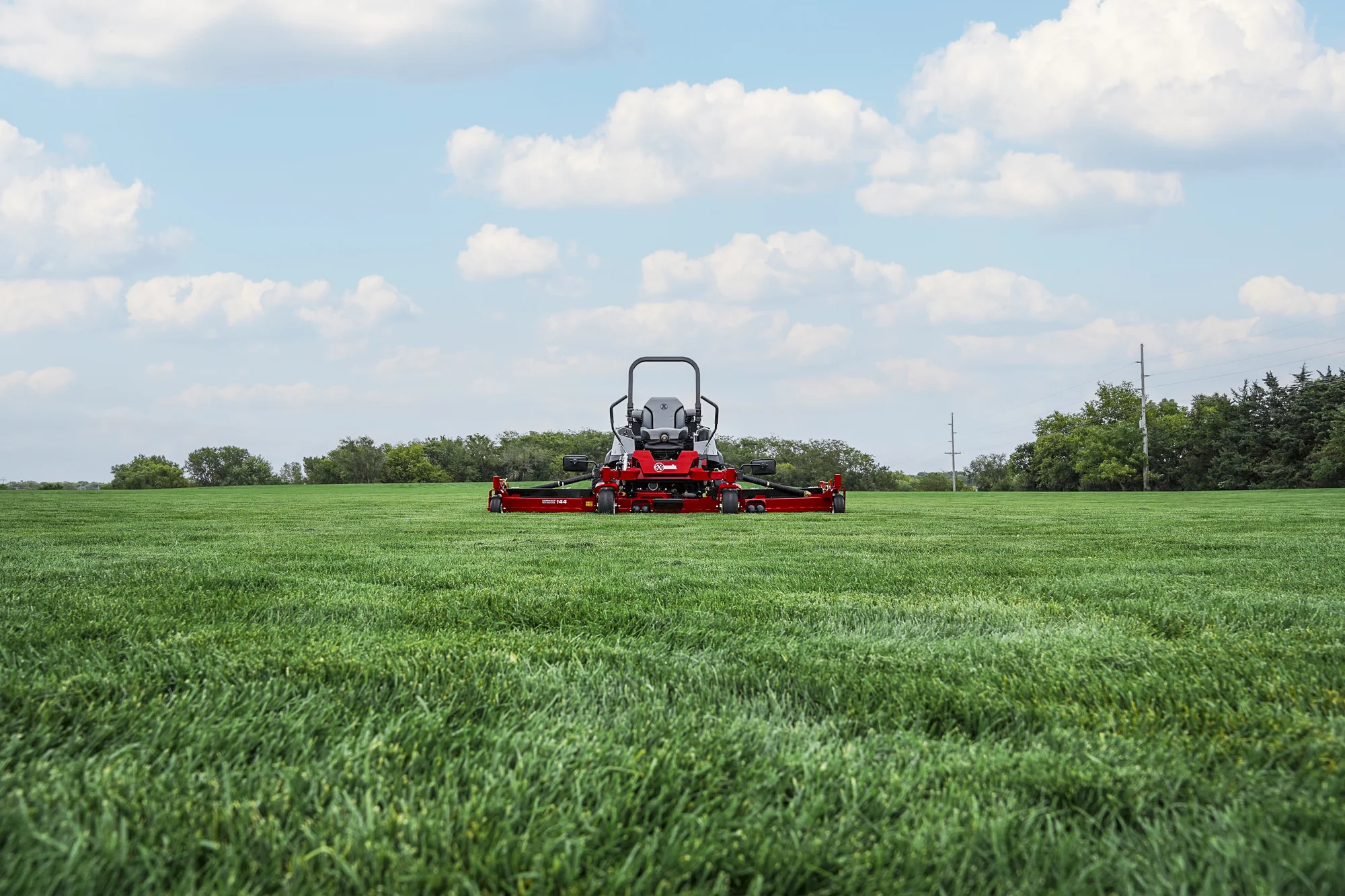 Exmark Lazer Z S Diesel Series Zero Turn Rider Lzs86Tdym12Rw0 Front View Mower On Lawn Distant product image