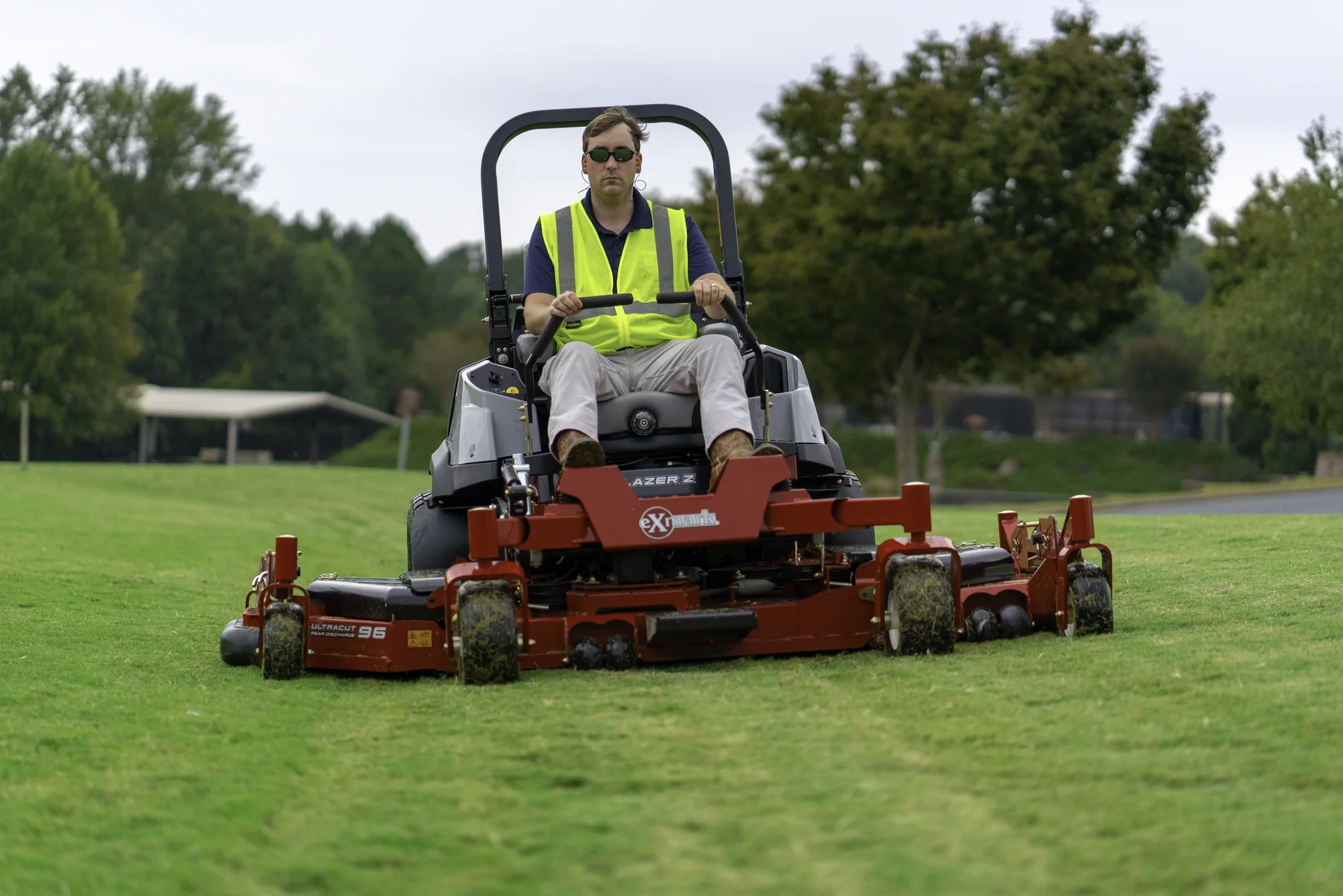 Exmark Lazer Z S Diesel Series Zero Turn Rider Lzs88Cdym96Rw0 Front View Landscaper Mowing Grass product image