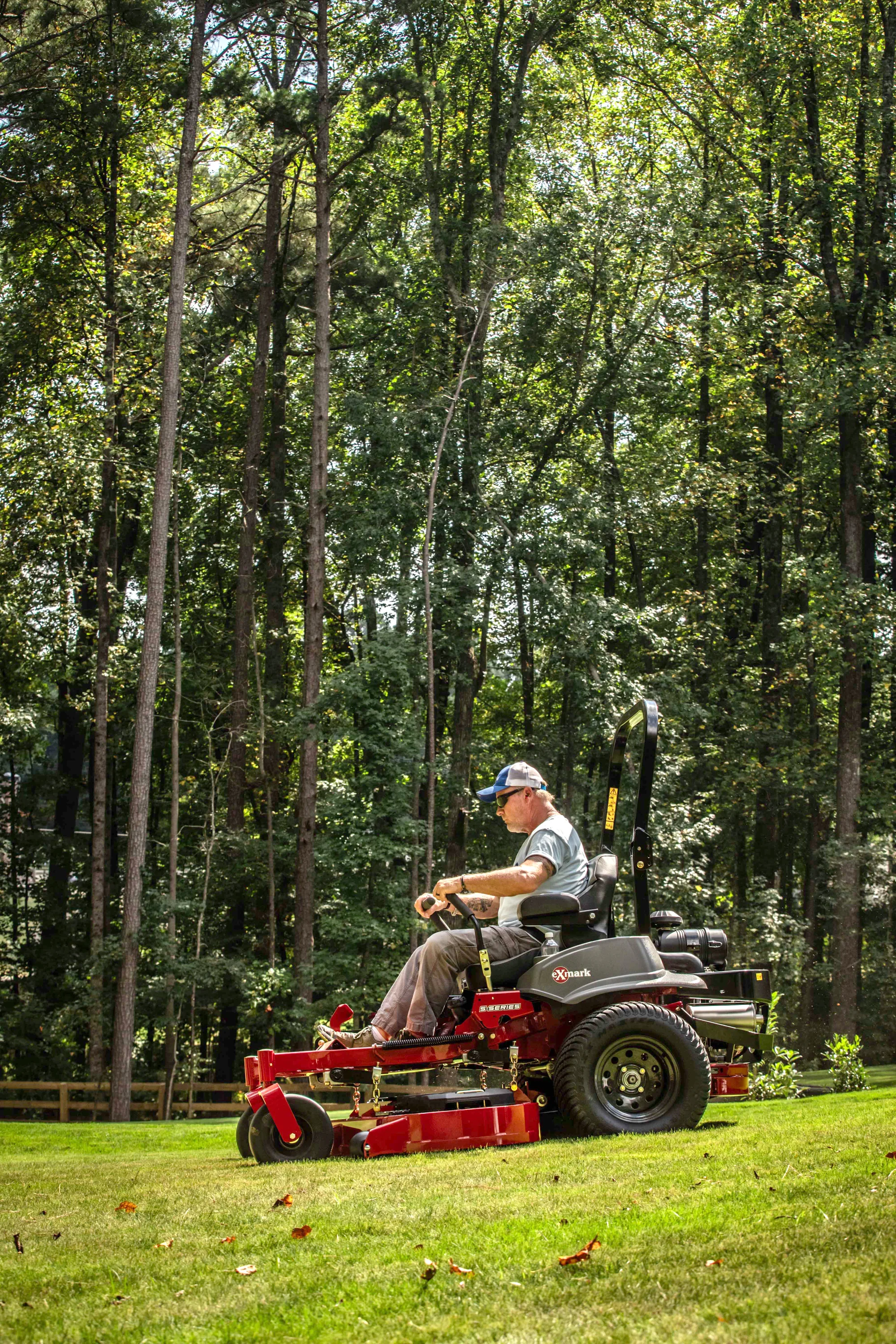 Exmark Lazer Z S Series Zero Turn Rider Lrs749Akc604A1 Man Mowing Lawn Forest product image