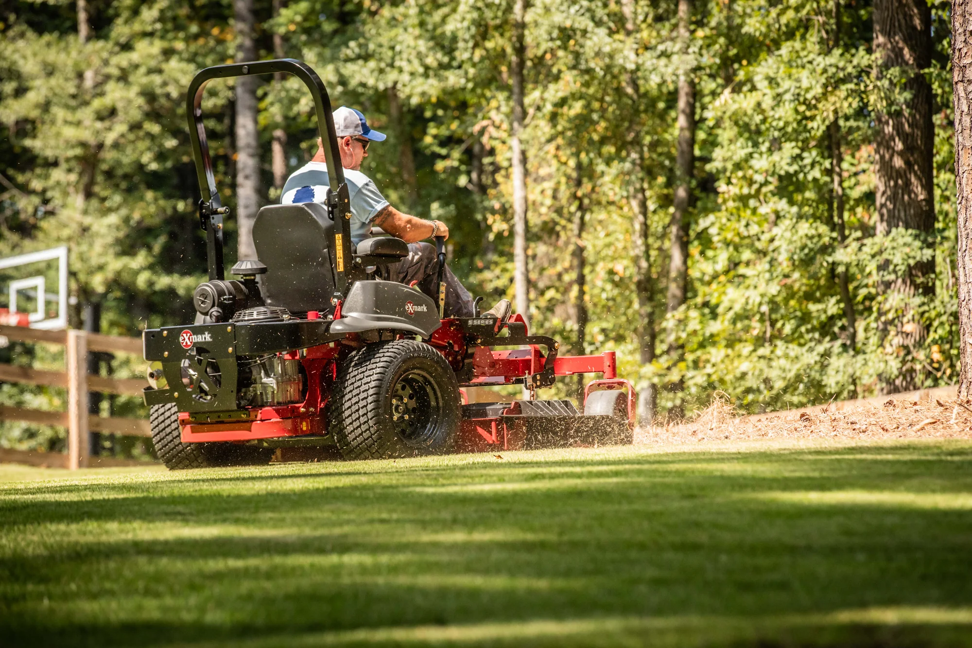 Exmark Lazer Z S Series Zero Turn Rider LRS801GKA604A1 Exmark Lazer Z S Series Zero Turn Rider Lrs801Gka604A1 Man Mowing Lawn Back View product image