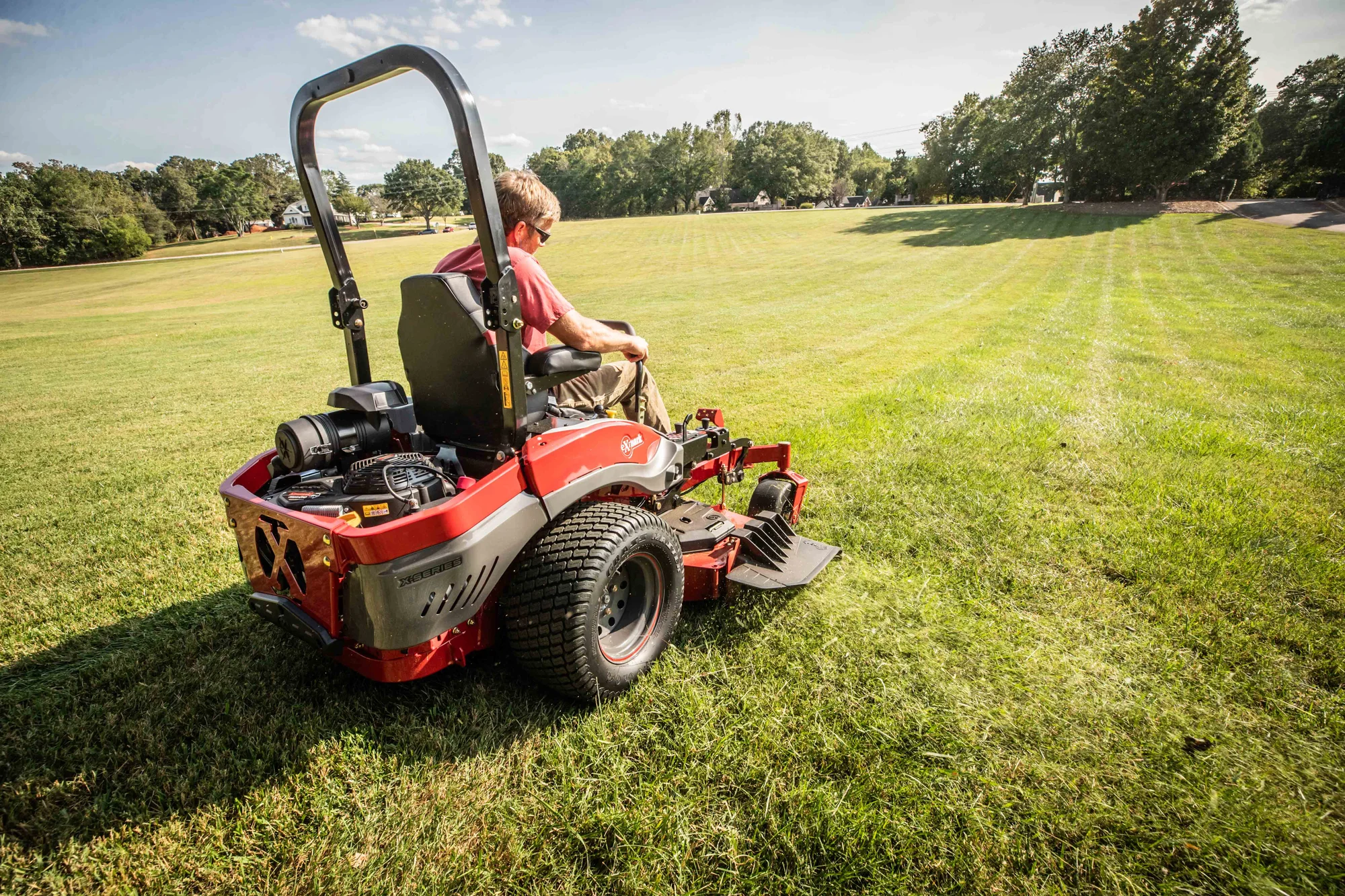 Exmark Lazer Z X Series Zero Turn Rider Lrx850Gka526Q1 Man Cutting Grass Park Wide Angle product image