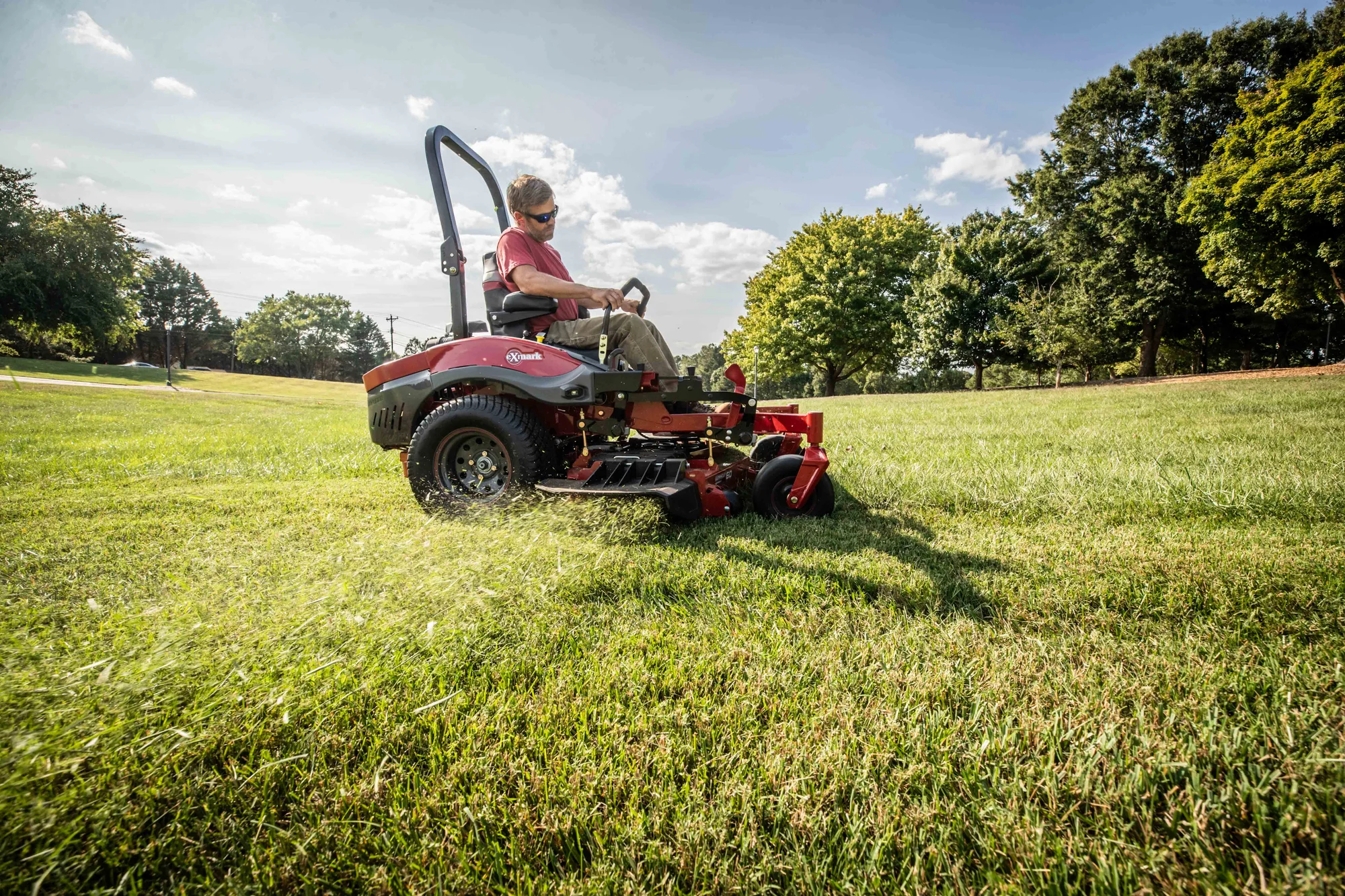 Exmark Lazer Z X Series Zero Turn Rider LRX850GKA606Q1 Exmark Lazer Z X Series Zero Turn Rider Lrx850Gka606Q1 Man Cutting Tall Grass Closeup product image