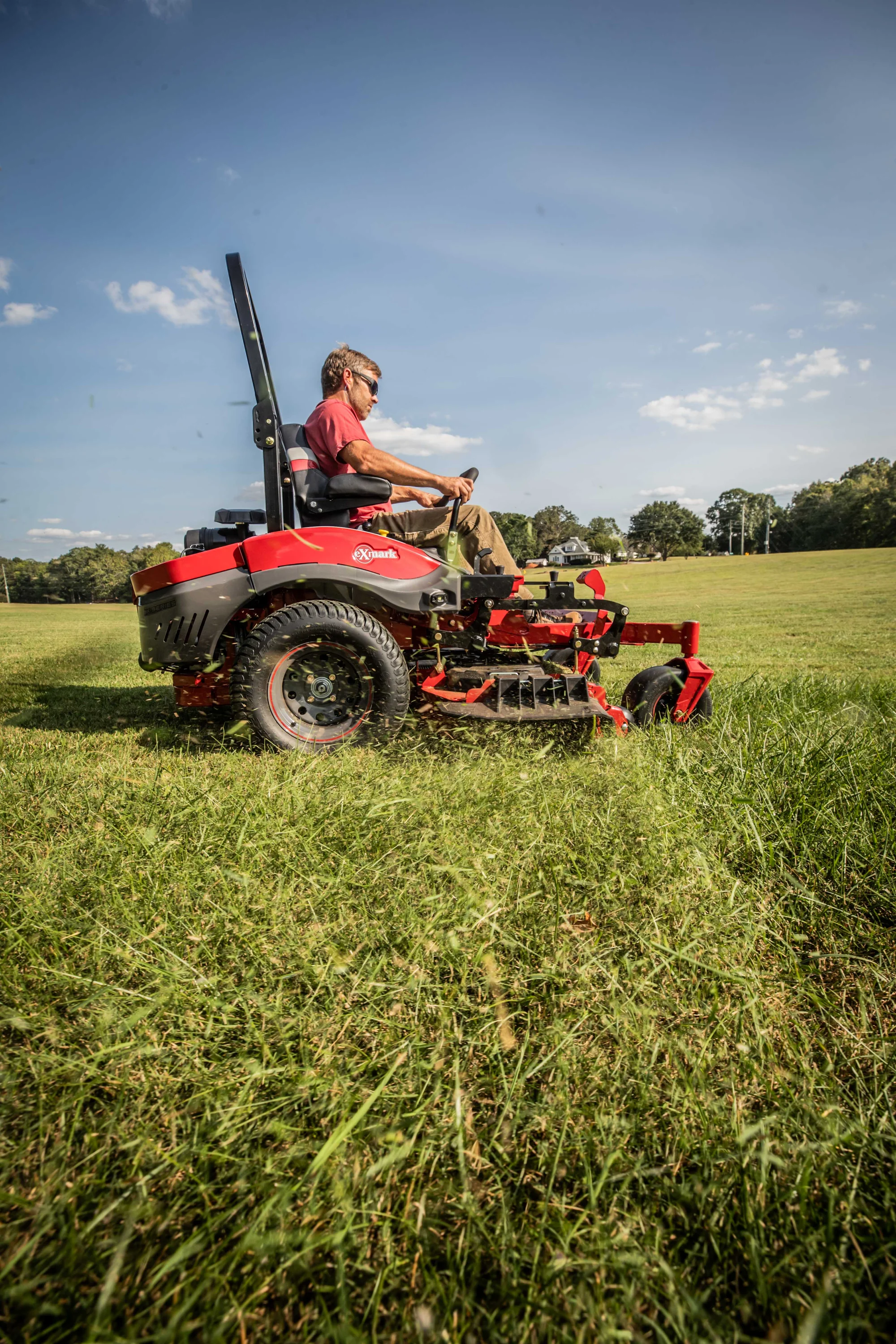 Exmark Lazer Z X Series Zero Turn Rider LRX850GKA606Q1 Exmark Lazer Z X Series Zero Turn Rider Lrx850Gka606Q1 Man Cutting Tall Grass Park product image