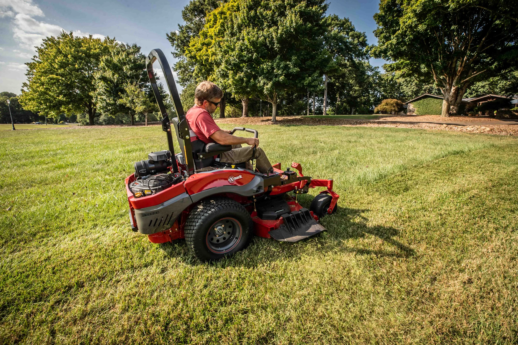 Exmark Lazer Z X Series Zero Turn Rider LRX980EKC606Q1 Exmark Lazer Z X Series Zero Turn Rider Lrx980Ekc606Q1 Man Cutting Grass Park product image