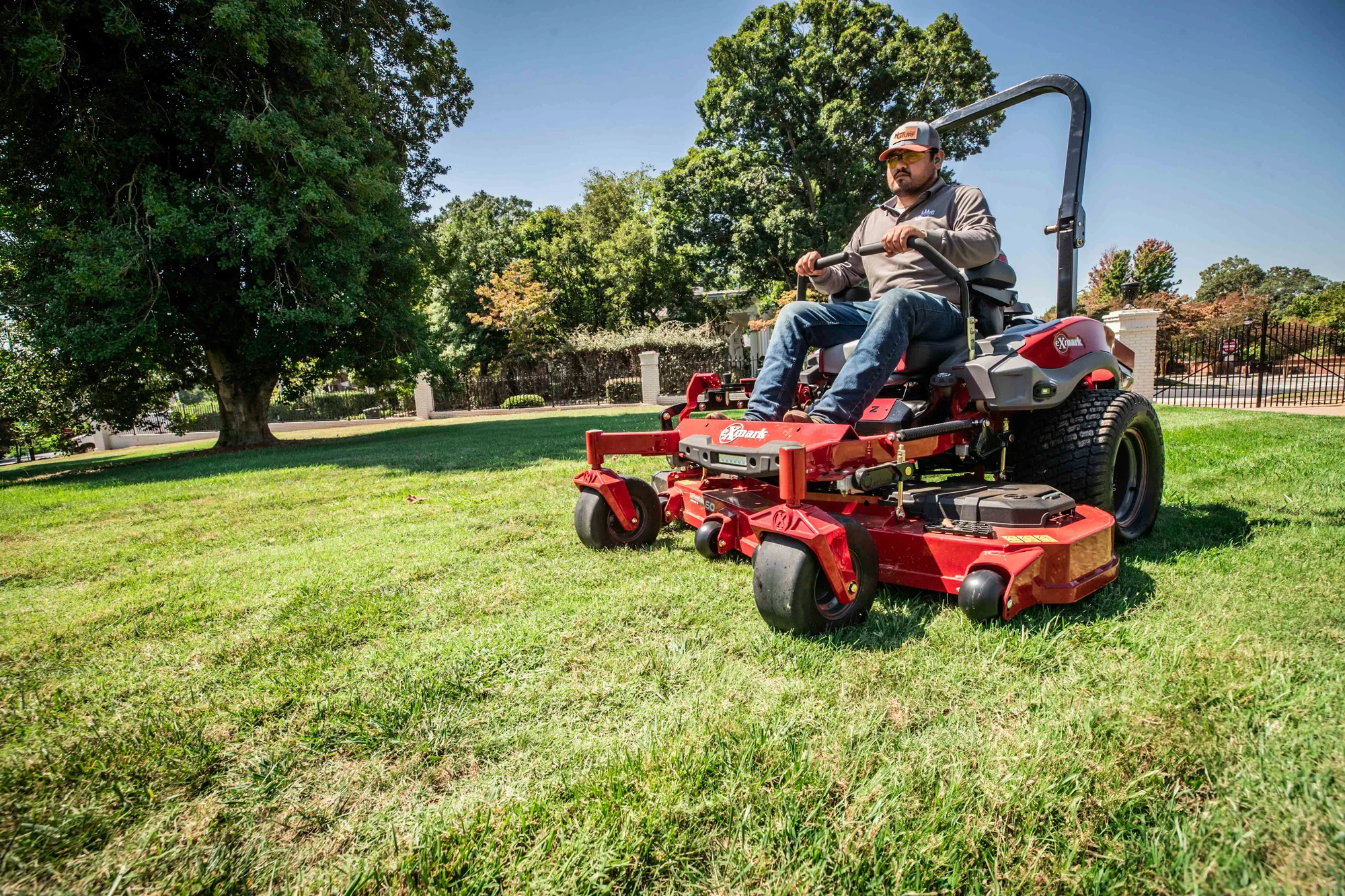 Exmark Lazer Z X Series Zero Turn Rider Lrx980Ekc726Q1 Man Mowing Lawn product image
