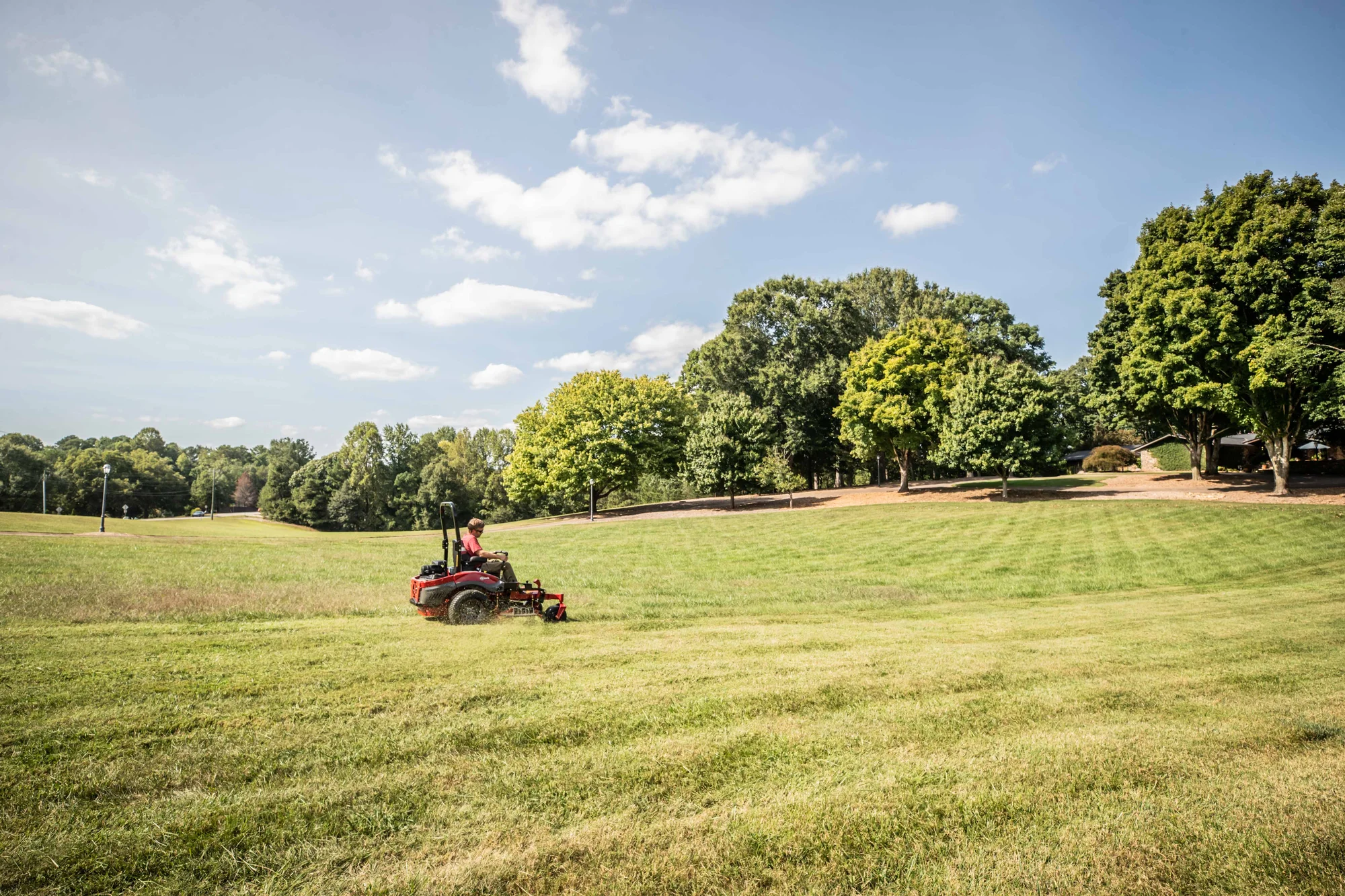 Exmark Lazer Z X Series Zero Turn Rider LRX993EBX726Q1 Exmark Lazer Z X Series Zero Turn Rider Lrx993Ebx726Q1 Man Striping Lawn Distant product image