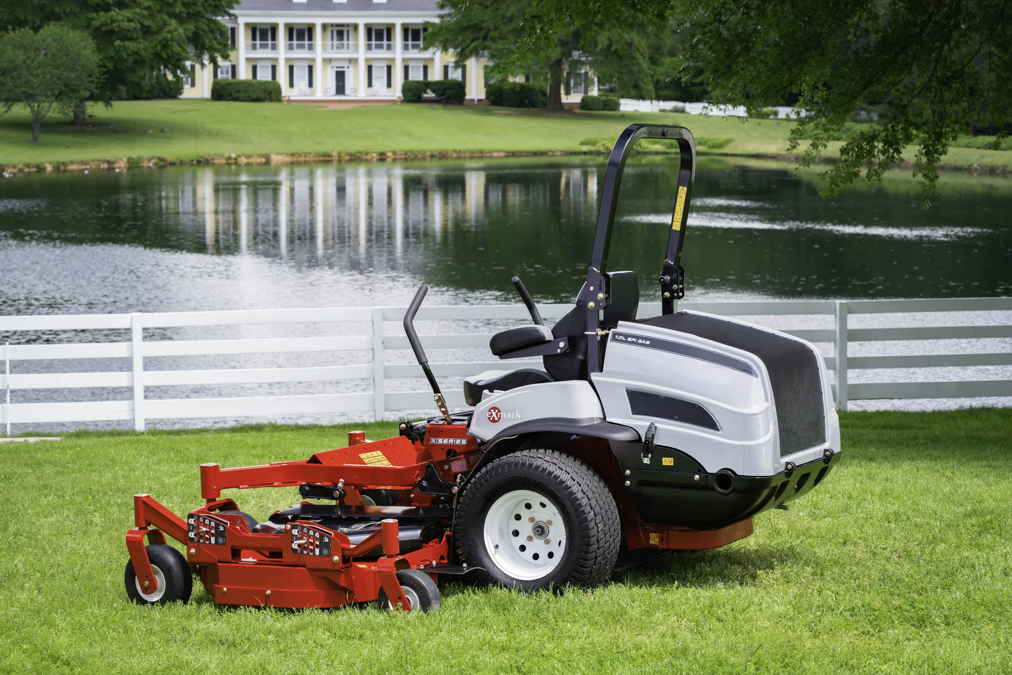 Exmark Lazer Z X Series Zero Turn Rider Lzx980Ekc96Rw0 Back View Mower On Estate Property product image