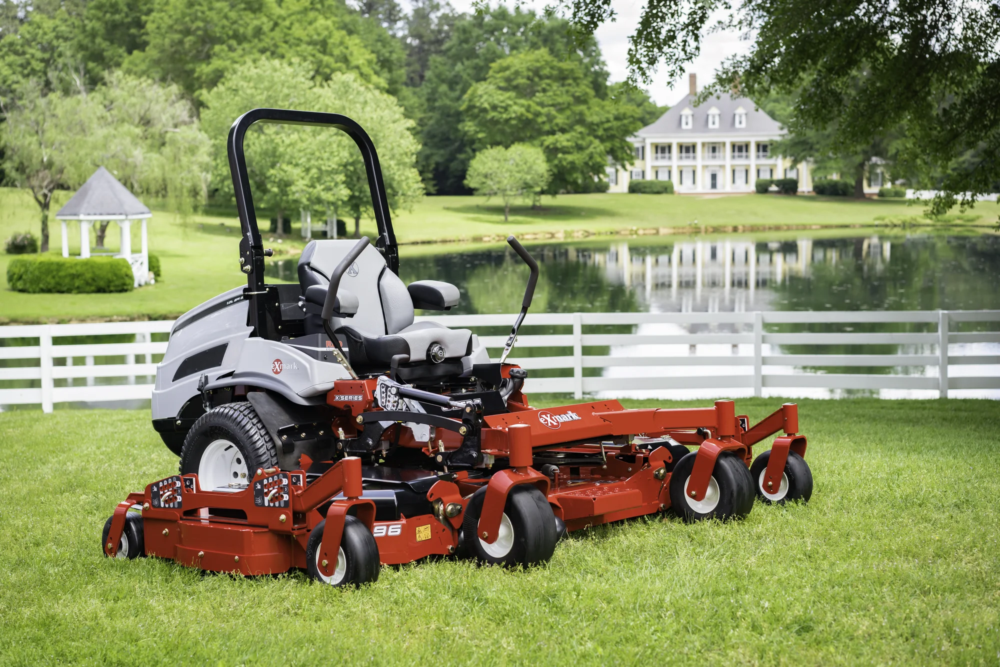 Exmark Lazer Z X Series Zero Turn Rider Lzx980Ekc96Rw0 Mower On Estate Grounds product image