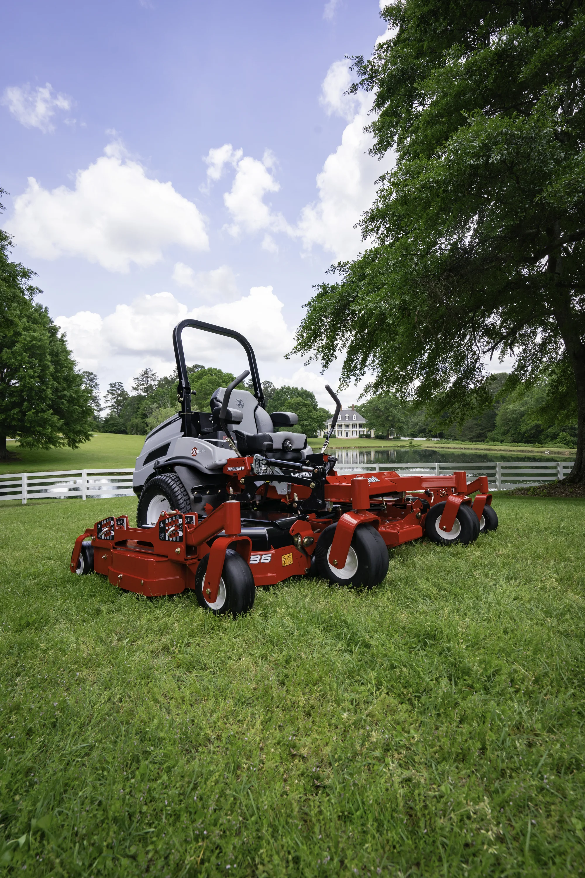 Exmark Lazer Z X Series Zero Turn Rider LZX980EKC96RW0 Exmark Lazer Z X Series Zero Turn Rider Lzx980Ekc96Rw0 Wide Angle Mower On Estate Grounds product image