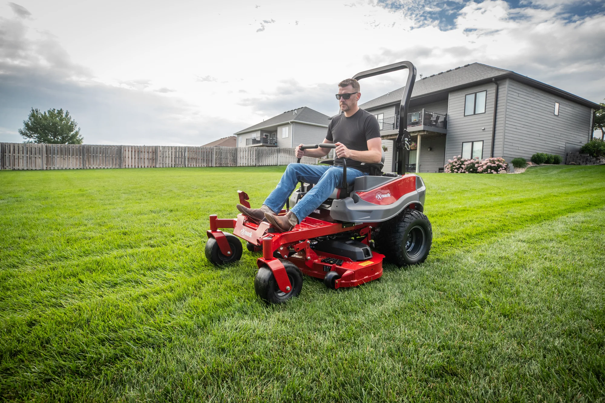 Exmark Radius E Series Zero Turn Rider Rde691Gka48200 Man On Mower Angle View Right product image