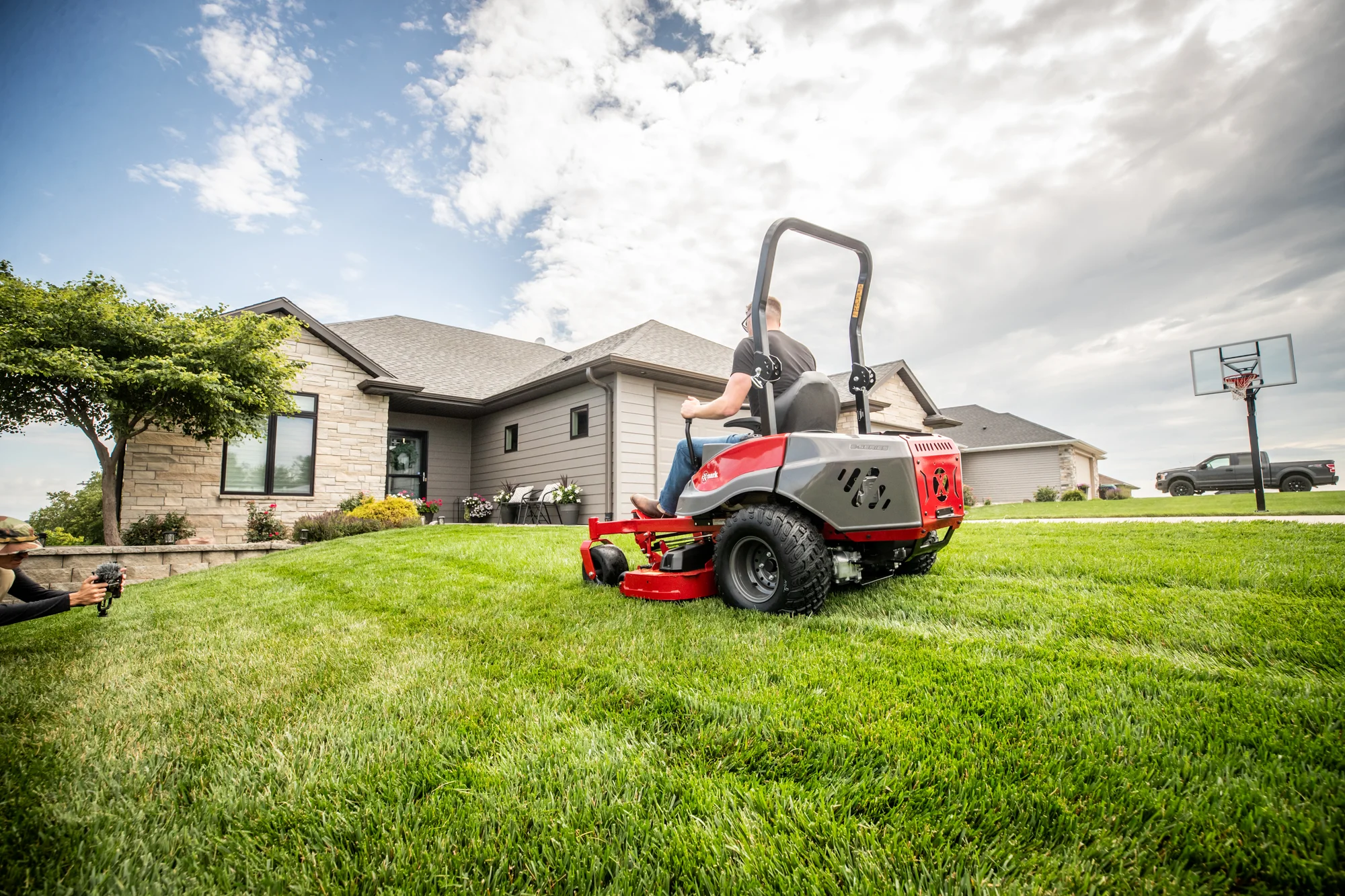 Exmark Radius E Series Zero Turn Rider RDE691GKA54200 Exmark Radius E Series Zero Turn Rider Rde691Gka54200 Man On Mower Back View product image