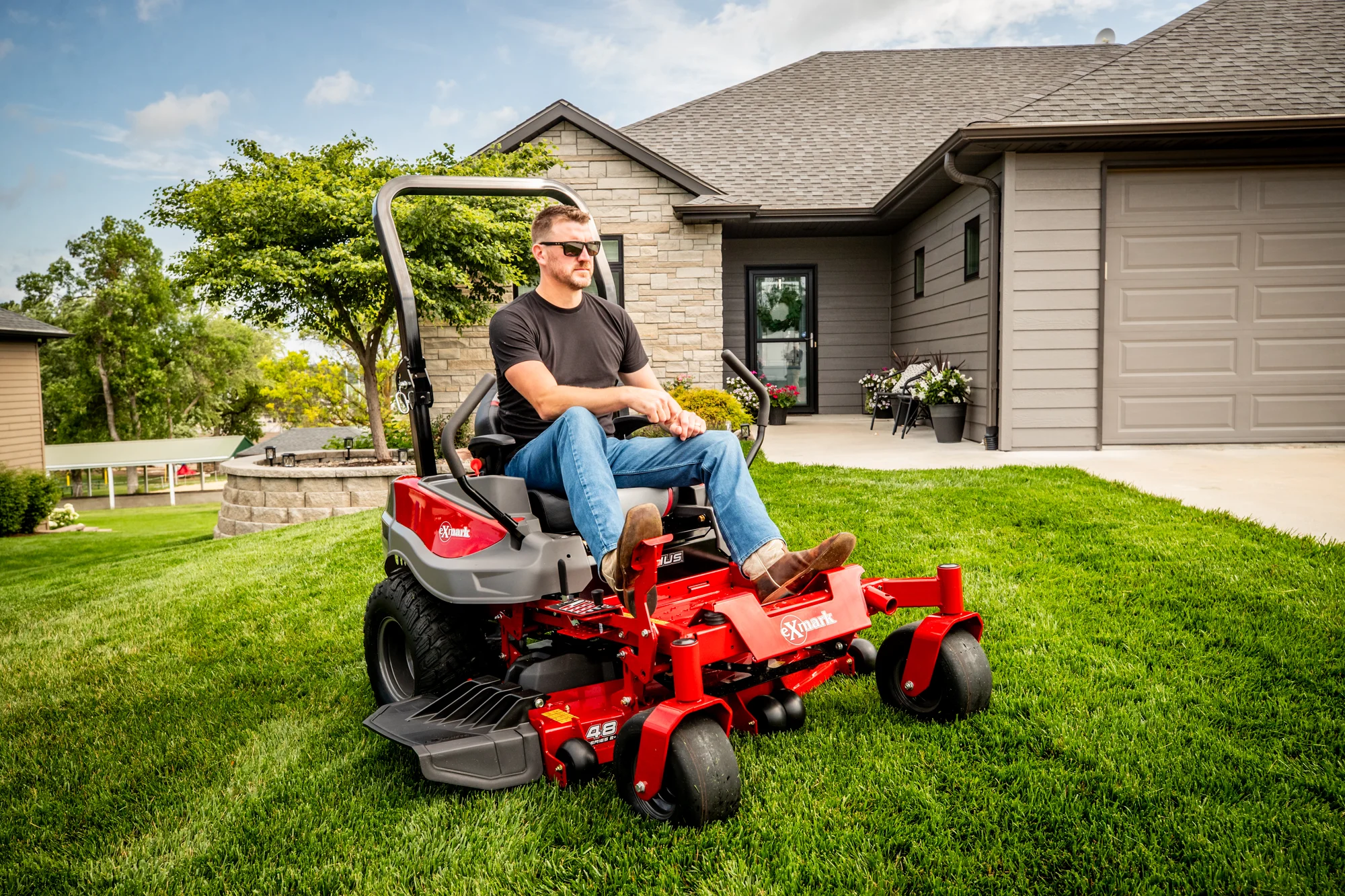 Exmark Radius E Series Zero Turn Rider RDE691GKA54200 Exmark Radius E Series Zero Turn Rider Rde691Gka54200 Man On Mower Closeup product image