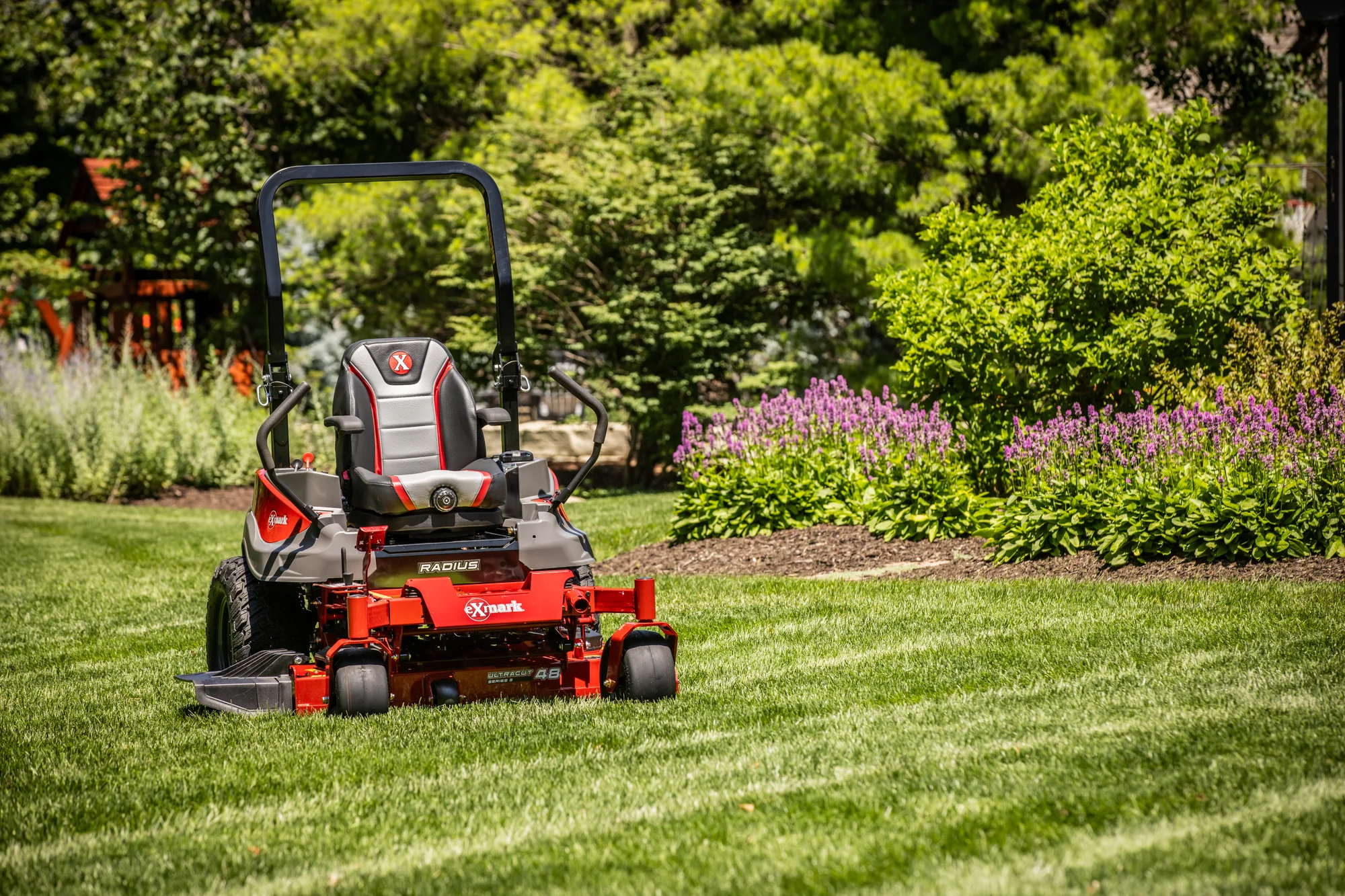 Exmark Radius S Series Zero Turn Rider RDS691GKA48CA3 Exmark Radius S Series Zero Turn Rider Rds691Gka48Ca3 Mower On Lawn Angle product image