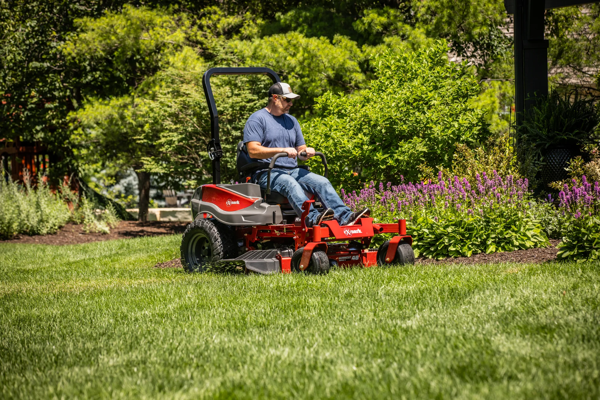 Exmark Radius S Series Zero Turn Rider RDS691GKA523A3 Exmark Radius S Series Zero Turn Rider Rds691Gka523A3 Man Cutting Grass product image