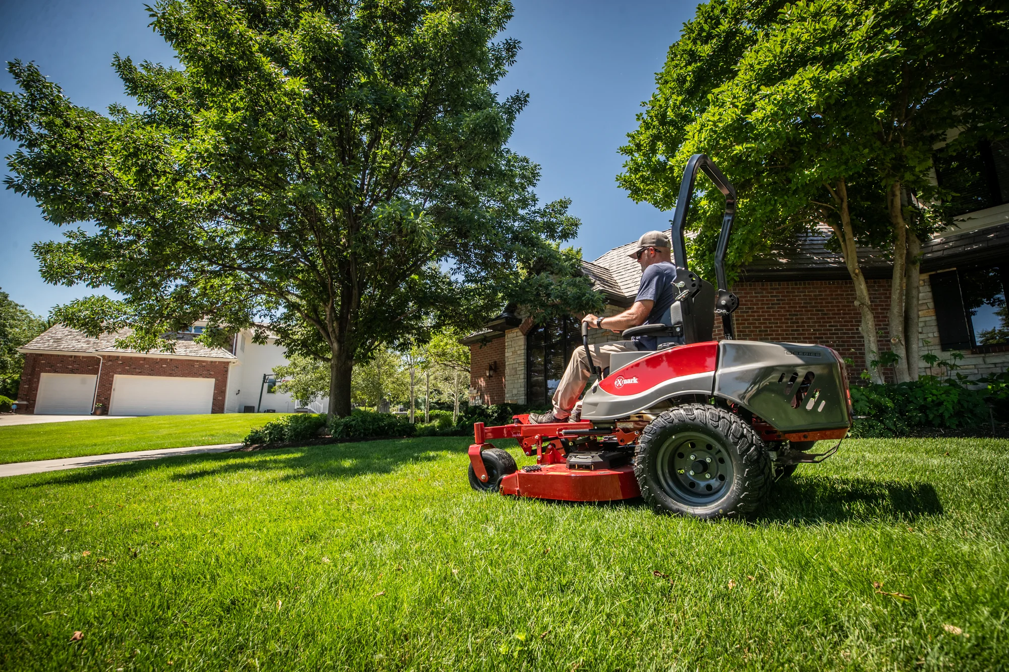 Exmark Radius S Series Zero Turn Rider RDS691GKA523A3 Exmark Radius S Series Zero Turn Rider Rds691Gka523A3 Man On Mower Wide Angle product image