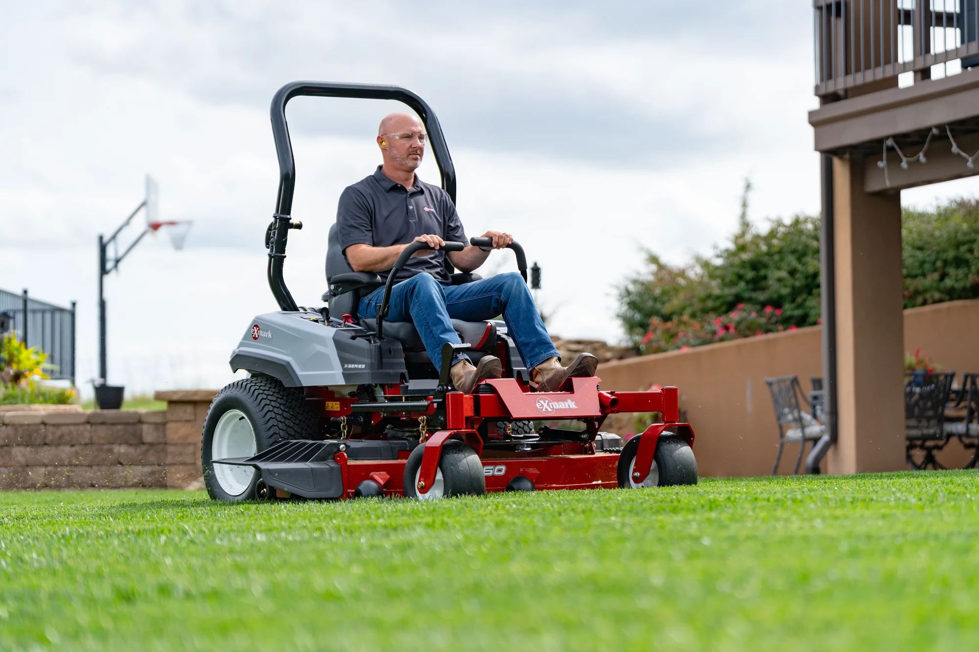 Exmark Radius X Series Zero Turn Rider Rdx730Gka604A3 Man Mowing Lawn Hill product image