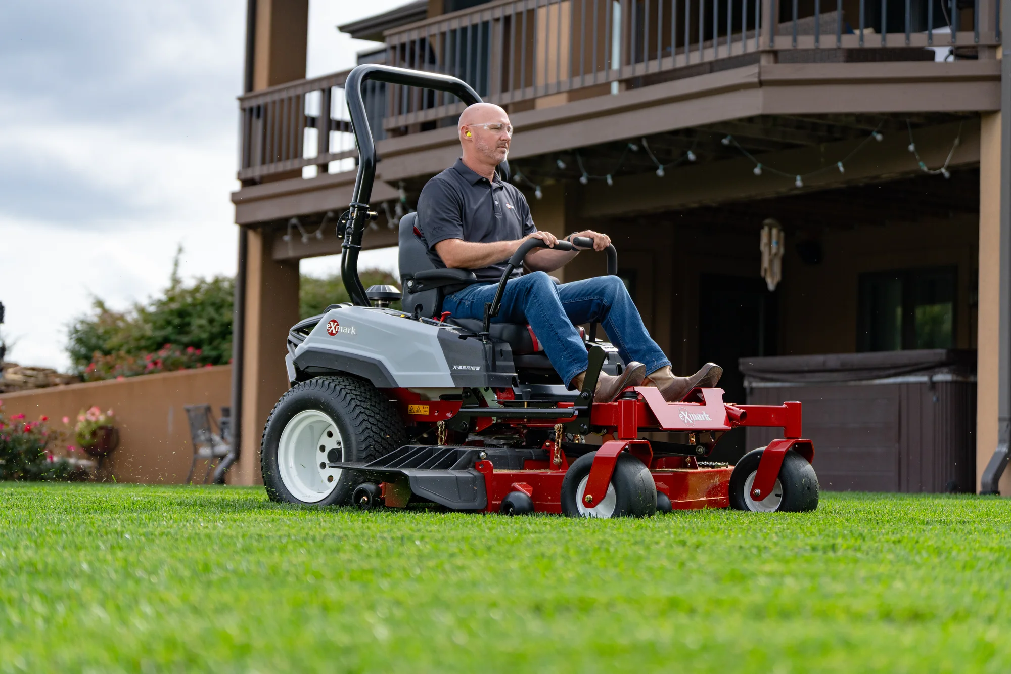 Exmark Radius X Series Zero Turn Rider Rdx730Gka604A3 Man Mowing Lawn House product image