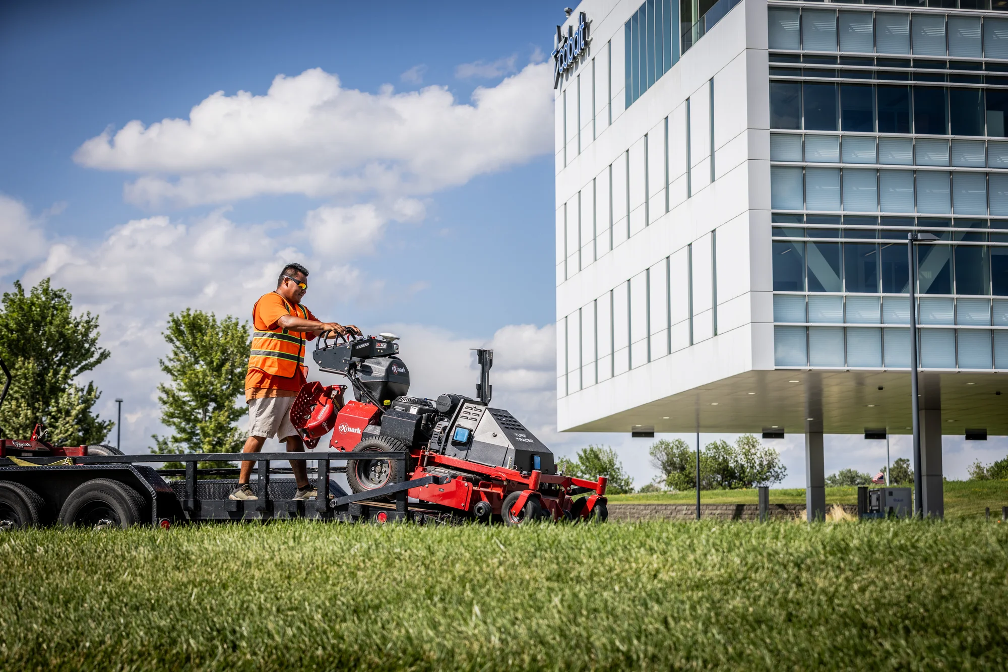 Exmark Turf Tracer Autonomous Series Walk Behind Lawn Mower Tta749Akc604N0 Man Mowing Commercial Property product image