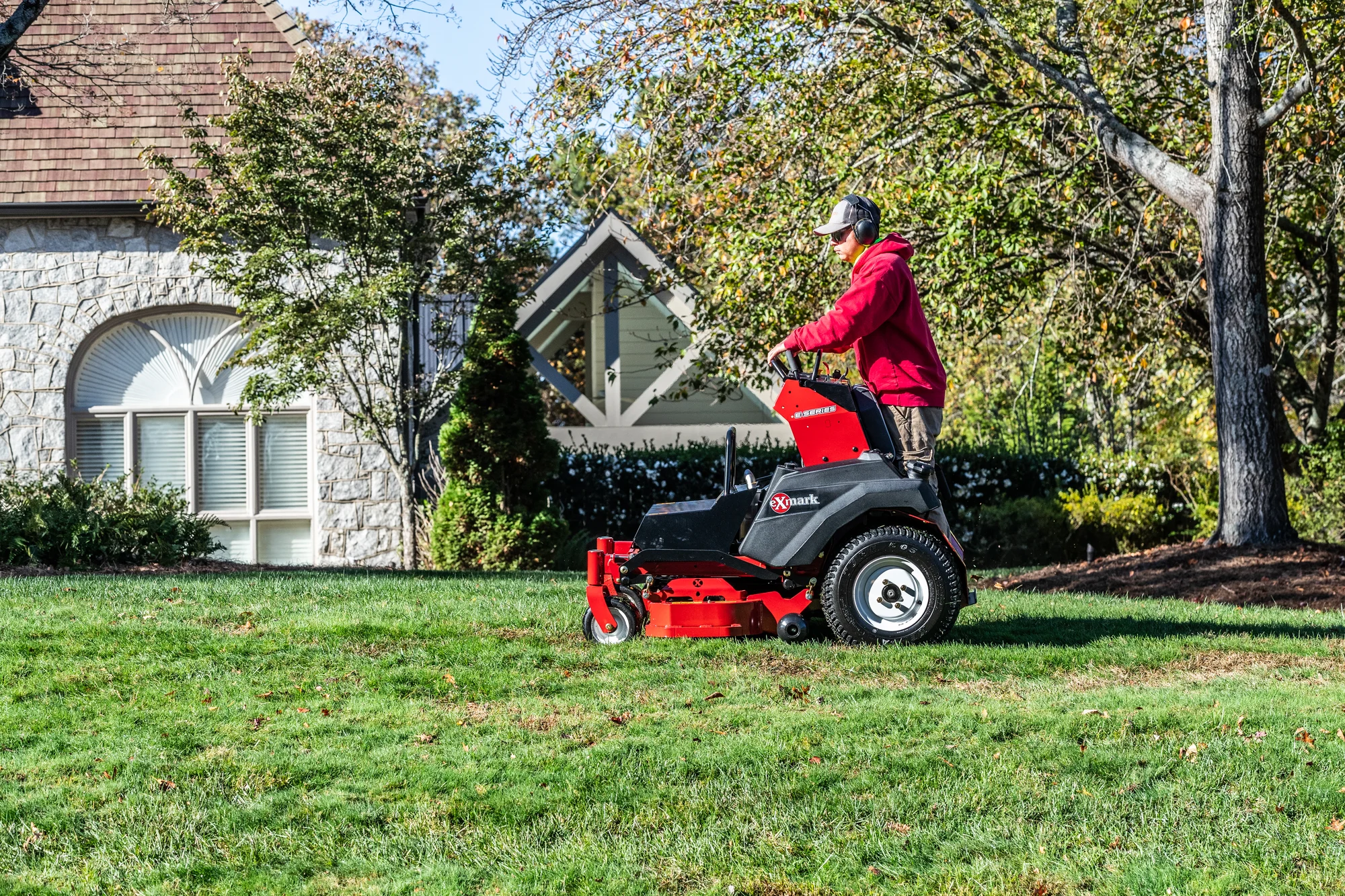 Exmark Vertex E Series Stand On Lawn Mower Vxe600Gka32300 Landscaper Mowing Lawn product image