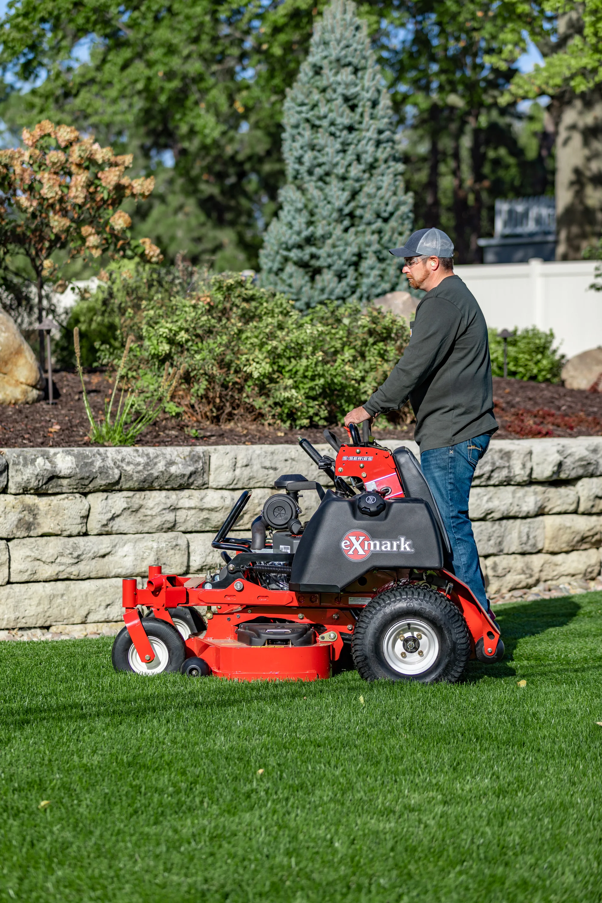 Exmark Vertex S Series Stand On Lawn Mower Vxs740Ekc52400 Man Mowing Near Paver Bricks product image