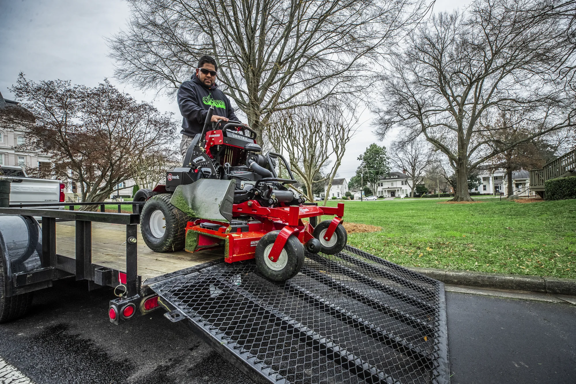 Exmark Vertex S Series Stand-On Lawn Mower VXS740EKC60400 Exmark Vertex S Series Stand On Lawn Mower Vxs740Ekc60400 Man Unloading Mower Truck product image