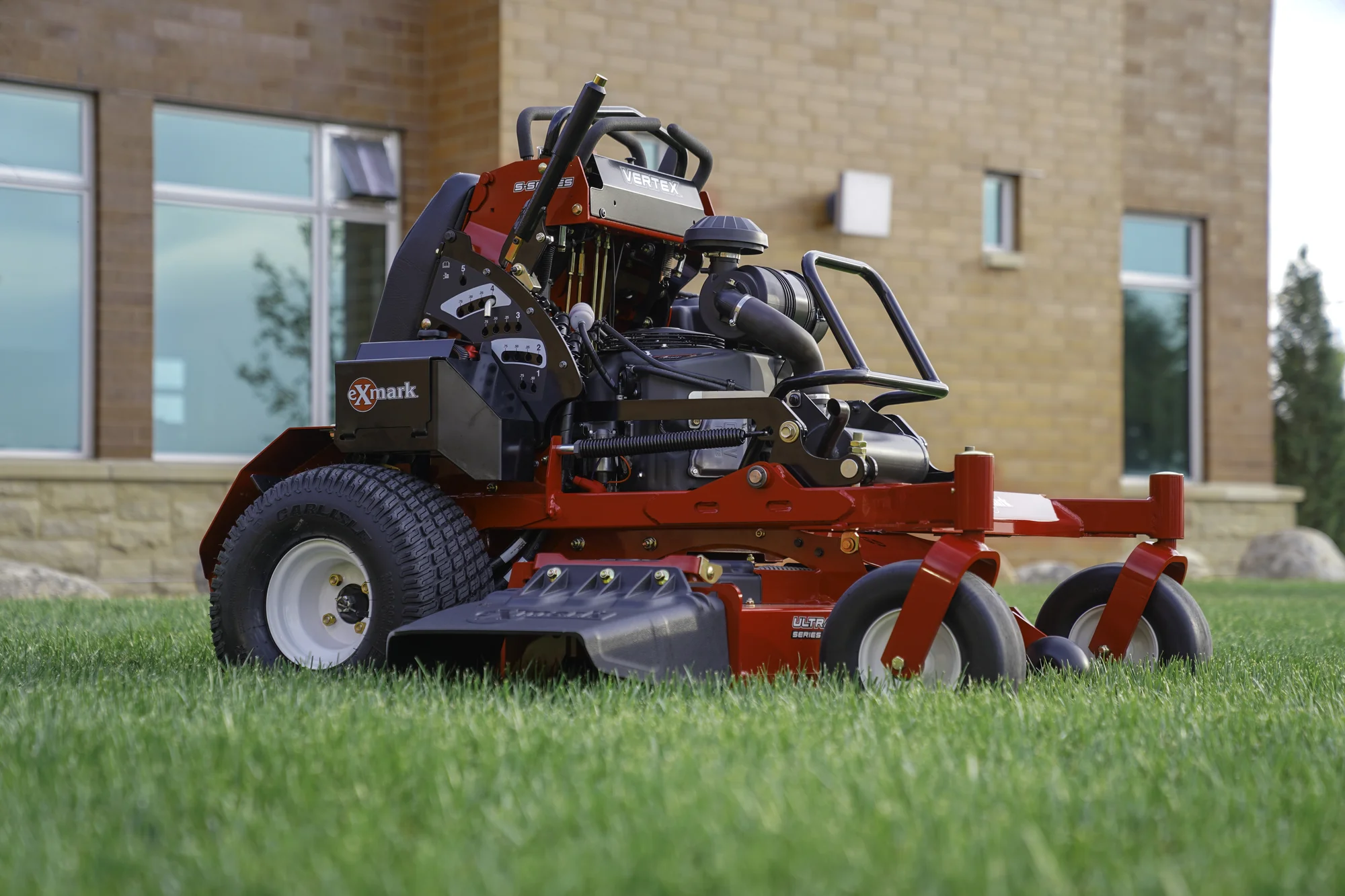 Exmark Vertex S Series Stand On Lawn Mower Vxs740Ekc60400 Side View Left Lawn Closeup product image