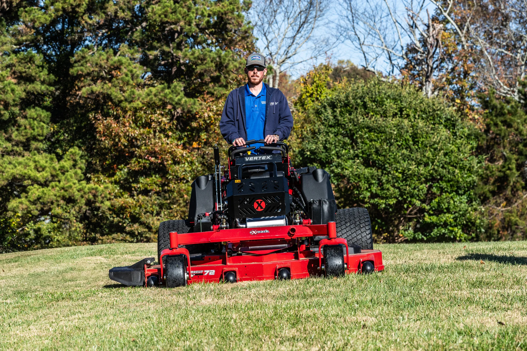 Exmark Vertex X Series Stand-On Lawn Mower VXX999EKA60600 Exmark Vertex X Series Stand On Lawn Mower Vxx999Eka60600 Front View Landscaper Mowing Property product image