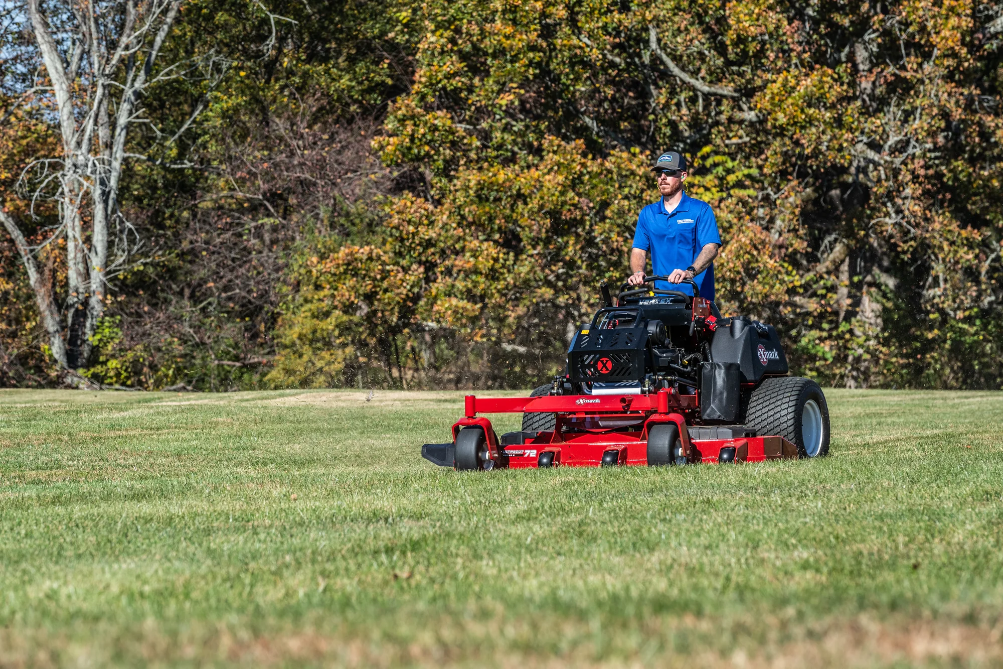 Exmark Vertex X Series Stand On Lawn Mower Vxx999Eka60600 Wide Angle Landscaper Mowing Property Closeup product image