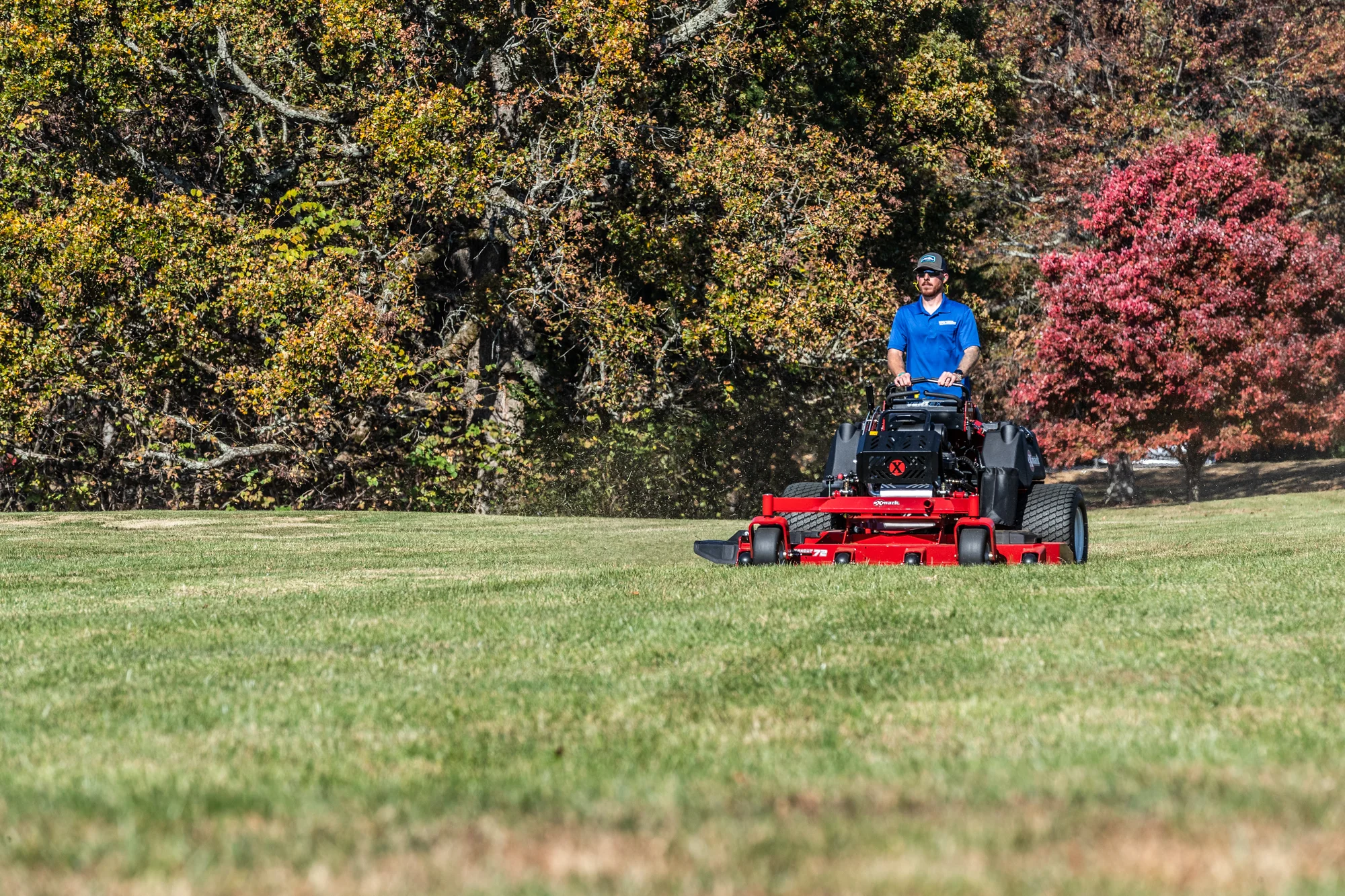 Exmark Vertex X Series Stand On Lawn Mower Vxx999Eka60600 Wide Angle Landscaper Mowing Property Trees product image