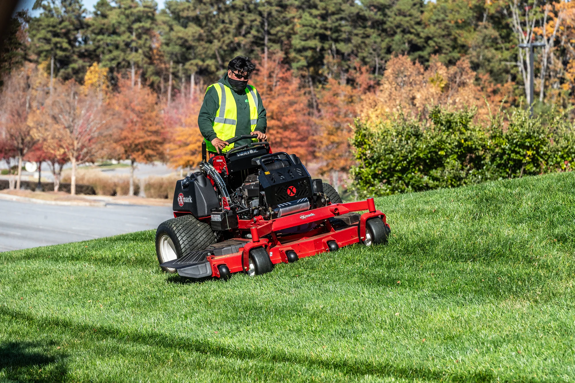 Exmark Vertex X Series Stand On Lawn Mower Vxx999Eka60600 Wide Angle Man With Mask Striping Hill product image