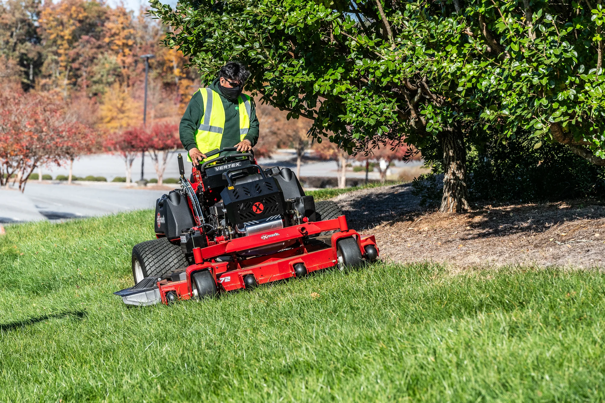 Exmark Vertex X Series Stand-On Lawn Mower VXX999EKA72600 Exmark Vertex X Series Stand On Lawn Mower Vxx999Eka72600 Man With Mask Mowing Hill product image