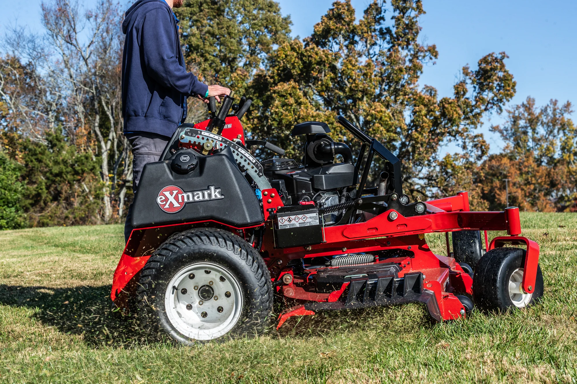 Exmark Vertex X Series Stand On Lawn Mower Vxx999Gka60600 Side View Man On Mower Closeup product image