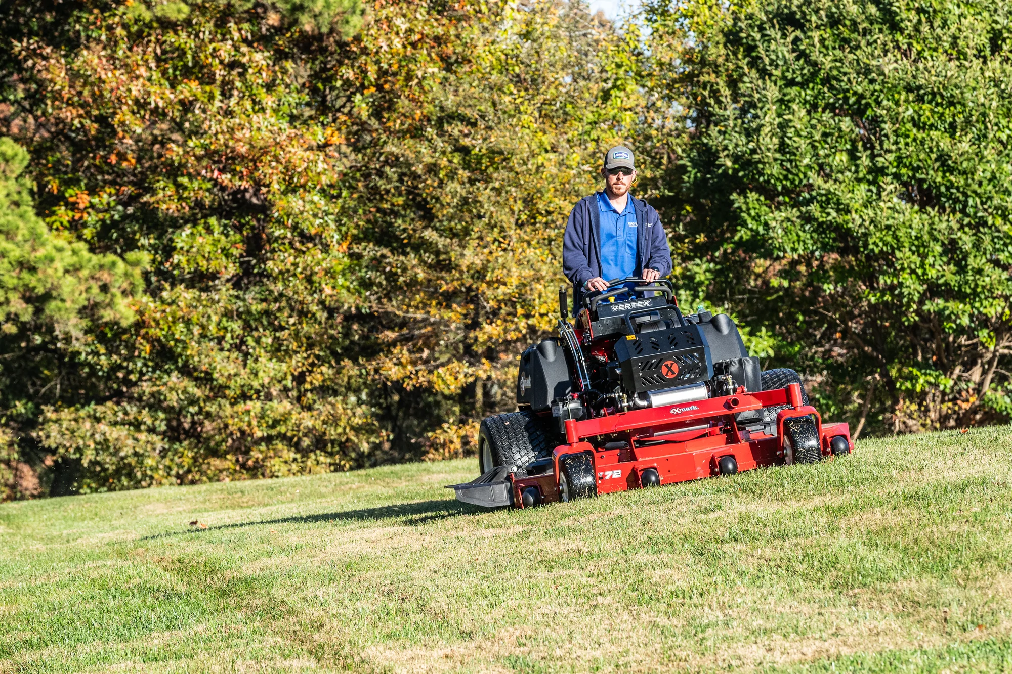 Exmark Vertex X Series Stand-On Lawn Mower VXX999GKA72600 Exmark Vertex X Series Stand On Lawn Mower Vxx999Gka72600 Landscaper Mowing Hill product image